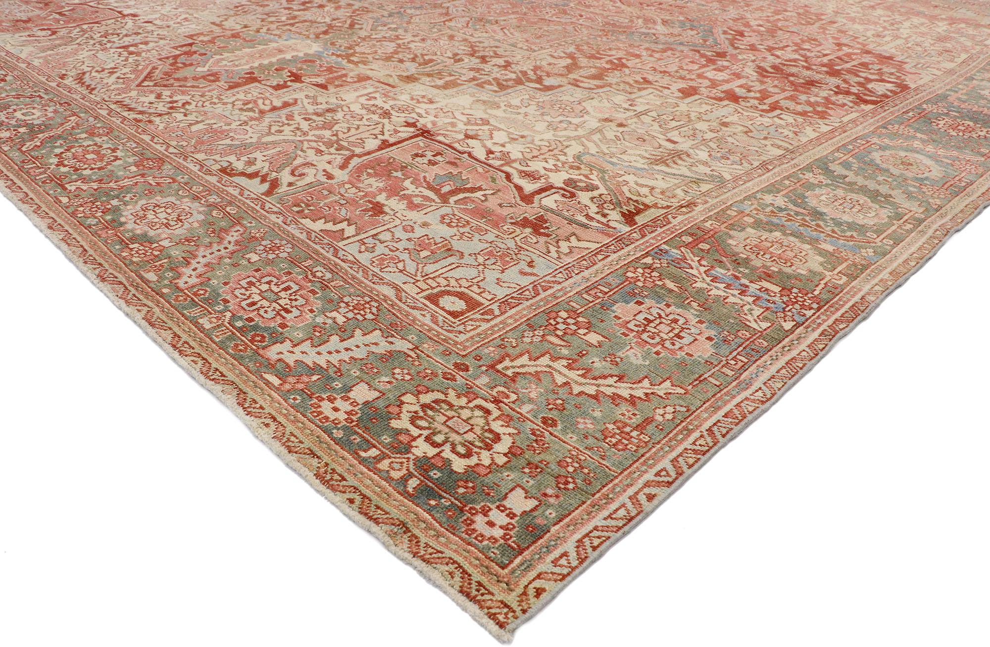 53245 Distressed Antique Persian Heriz Rug, 11'08 x 13'08. Persian Heriz rugs, hailing from northwest Iran's Heris region, are prized for their precise geometric patterns and detailed motif outlining. These rugs, crafted from premium wool sourced