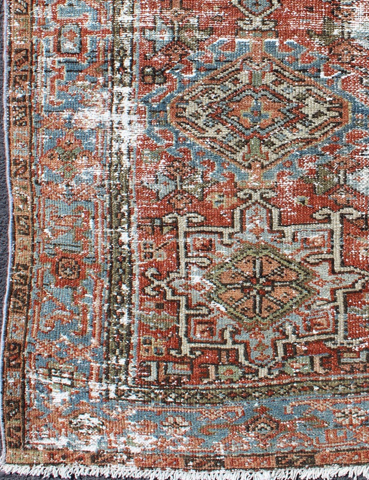 Persian Karadjeh antique rug with distressed geometric design in shades of red with dark accents, rug gng-4748, country of origin / type: Iran / Karadjeh, circa 1920

This early 20th century, handwoven antique Persian Karadjeh rug features a
