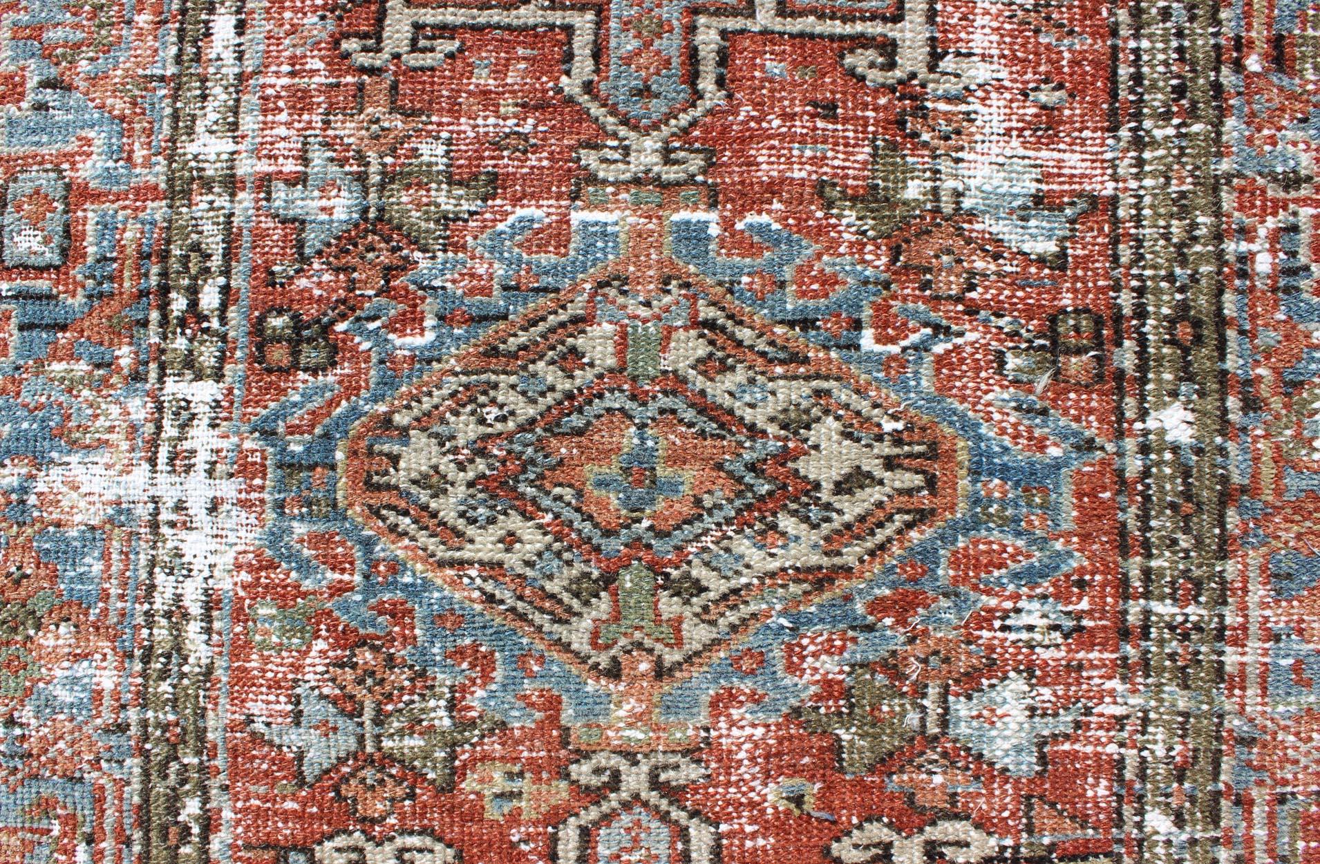 Early 20th Century Distressed Antique Persian Karadjeh Rug with Geometric Medallions and Accents For Sale