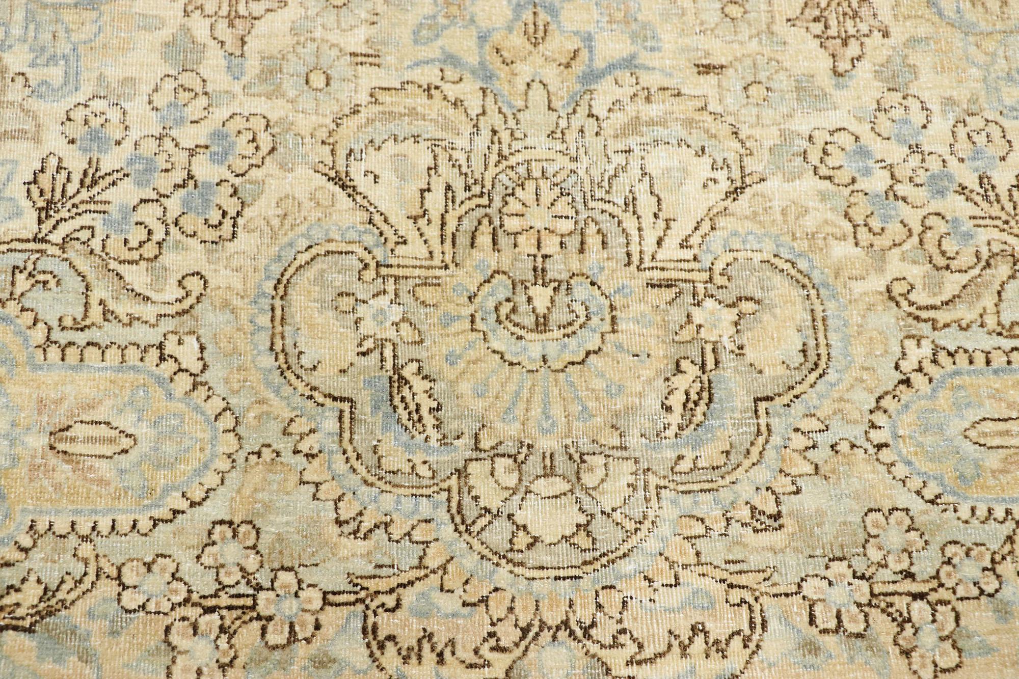 Kirman Distressed Antique Persian Kerman Palace Rug with Cotswold Country Cottage Style For Sale