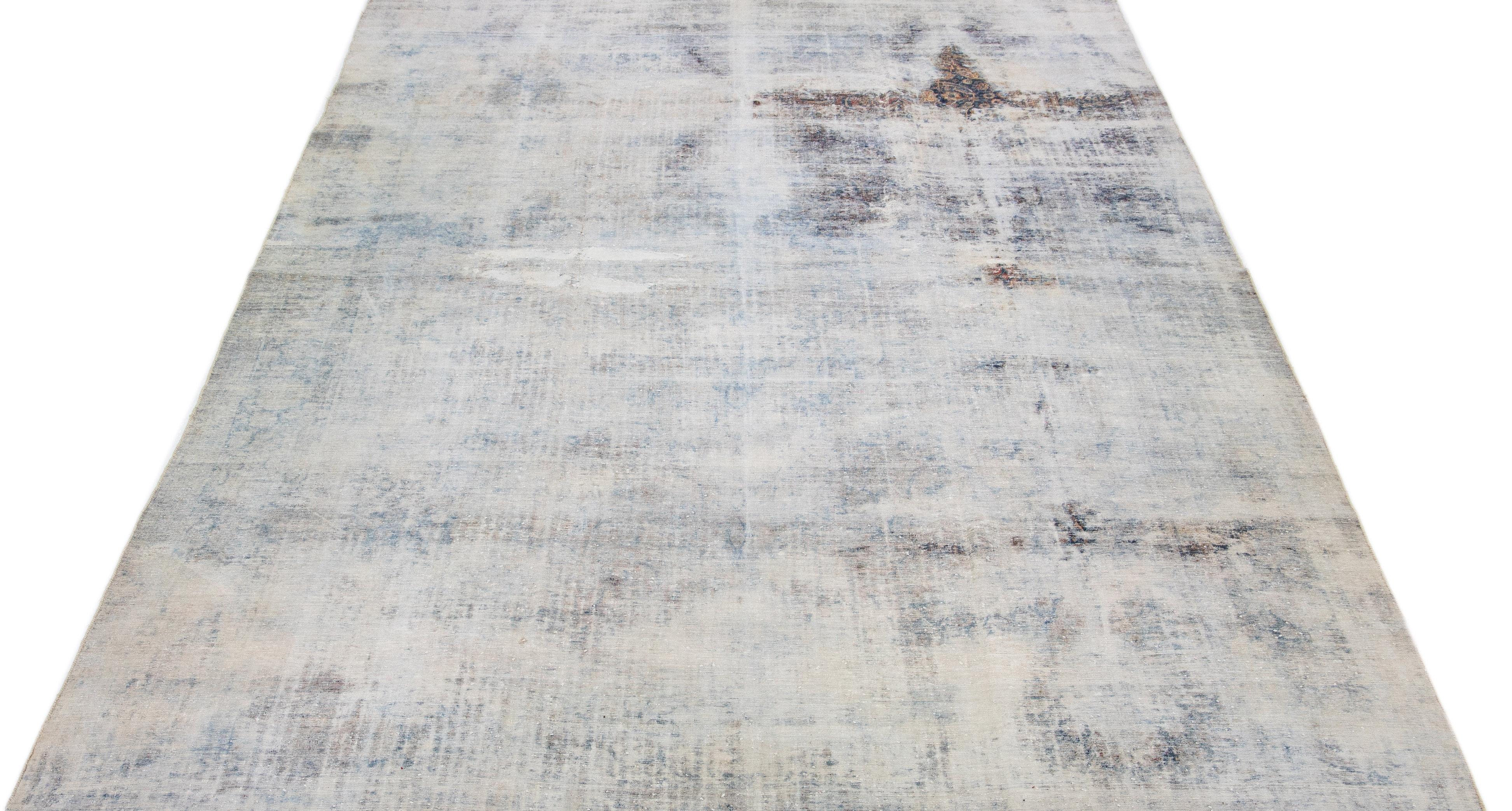 A classic hand-woven Kerman rug with an intricate all-over pattern displayed on a neutral beige backdrop alongside charming blue tones.

This rug measures 10'3