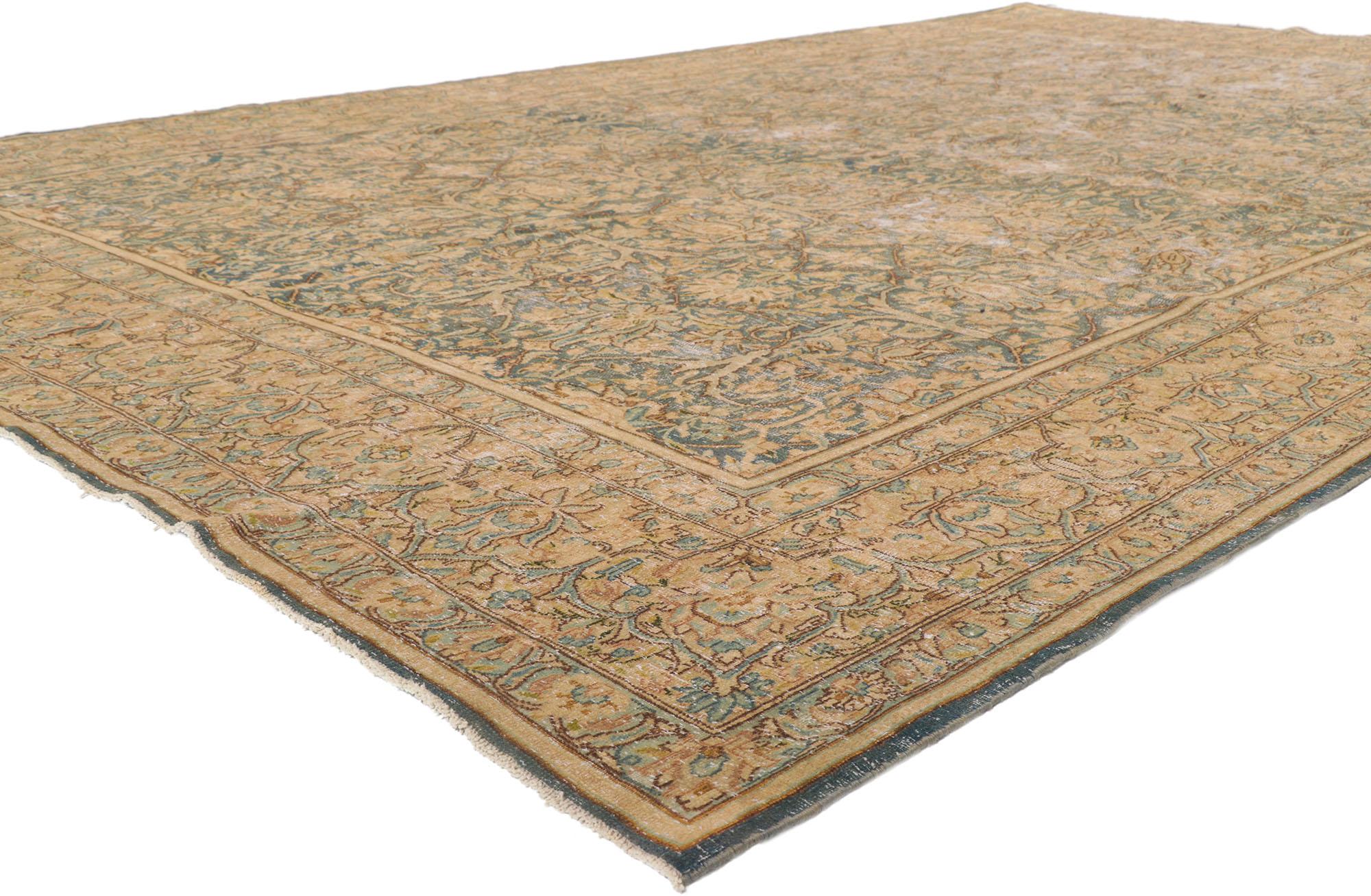 53765 Antique-Worn Persian Kerman Rug, 08'09 x 13'05.
Featuring a traditional botanical design and exuding rugged beauty, this hand-knotted wool distressed antique Persian Kerman rug effortlessly captures the essence of nostalgic charm. The tranquil