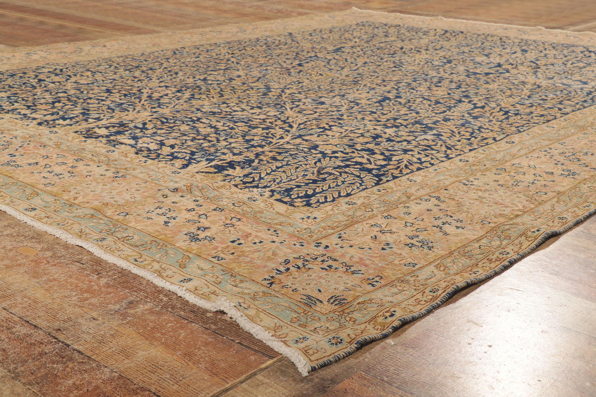 20th Century Distressed Antique Persian Kerman Rug with Millefleur Design For Sale