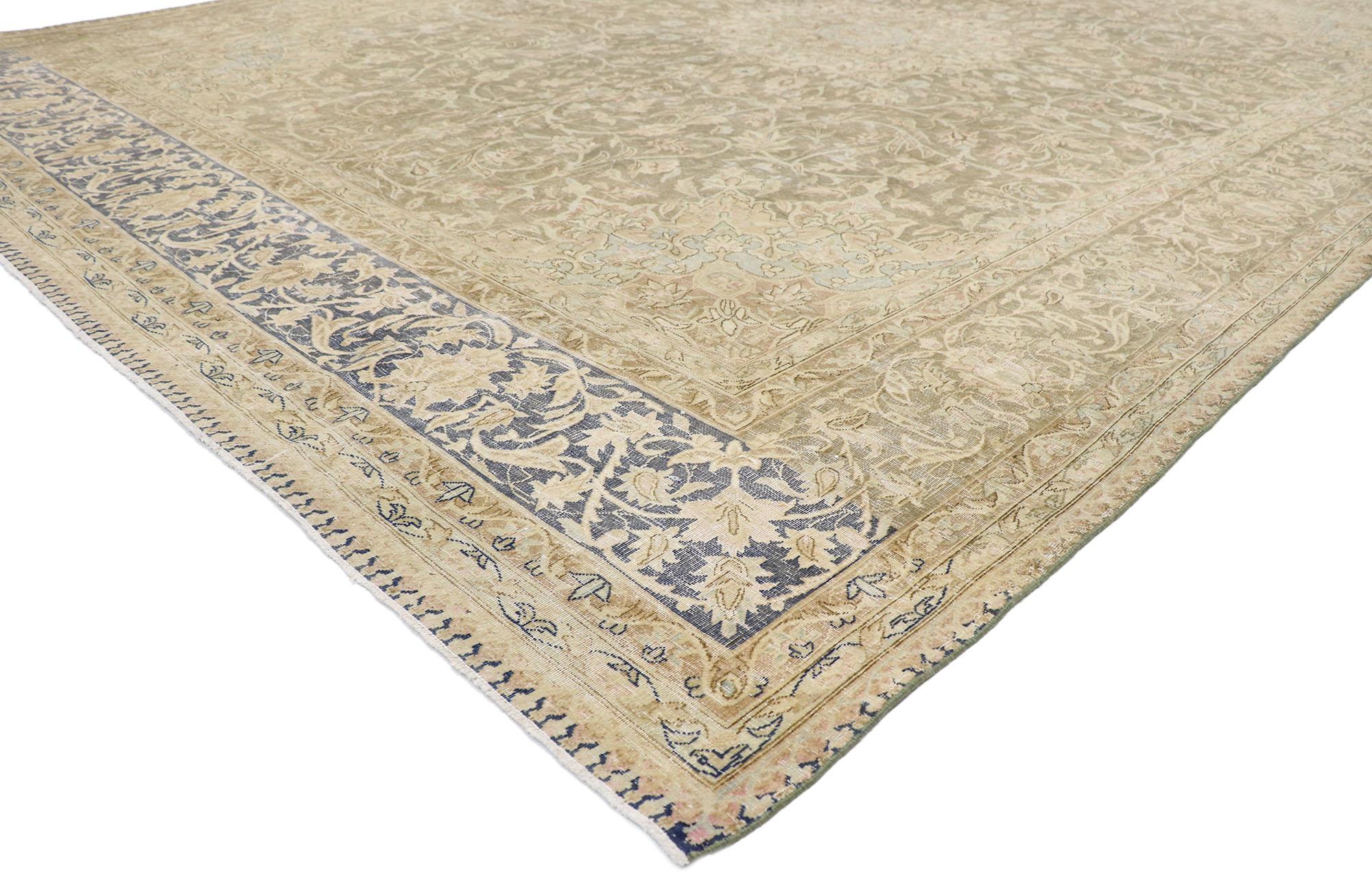 60828 Distressed Antique Persian Kerman rug with Rustic French Country style. With its timeless floral design and rustic sensibility, this hand-knotted wool distressed antique Persian Kerman rug beautifully embodies French Country simplicity. The