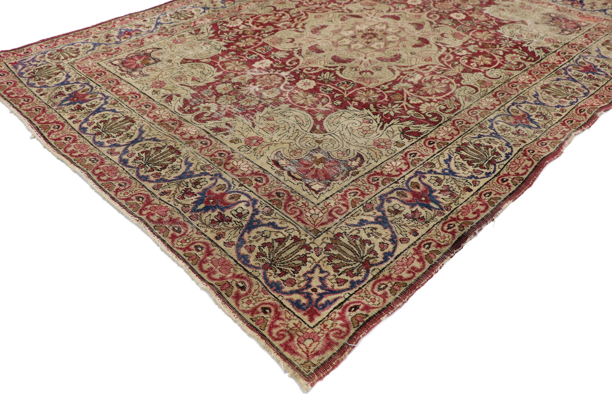 77608, distressed antique Persian Kerman rug with rustic old World Victorian style. Displaying a lovingly time-worn composition and a hint of romantic connotations with rustic sensibility, this hand knotted wool distressed antique Persian Kerman rug