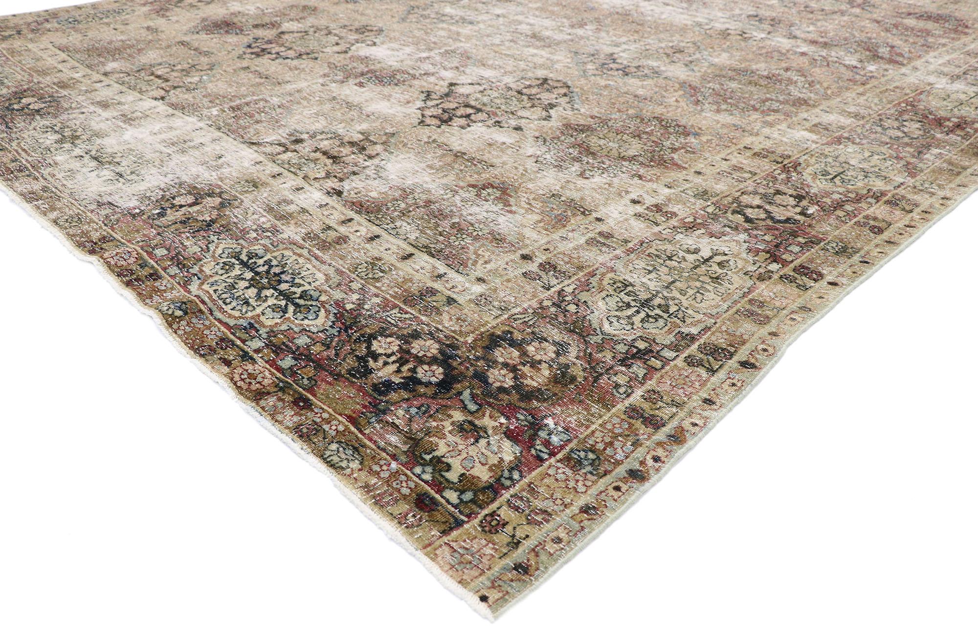 60837, distressed antique Persian Kerman rug with Rustic Renaissance style. Cleverly composed and distinctively well-balanced, this hand knotted wool distressed antique Persian Kerman rug will take on a curated lived-in look that feels timeless