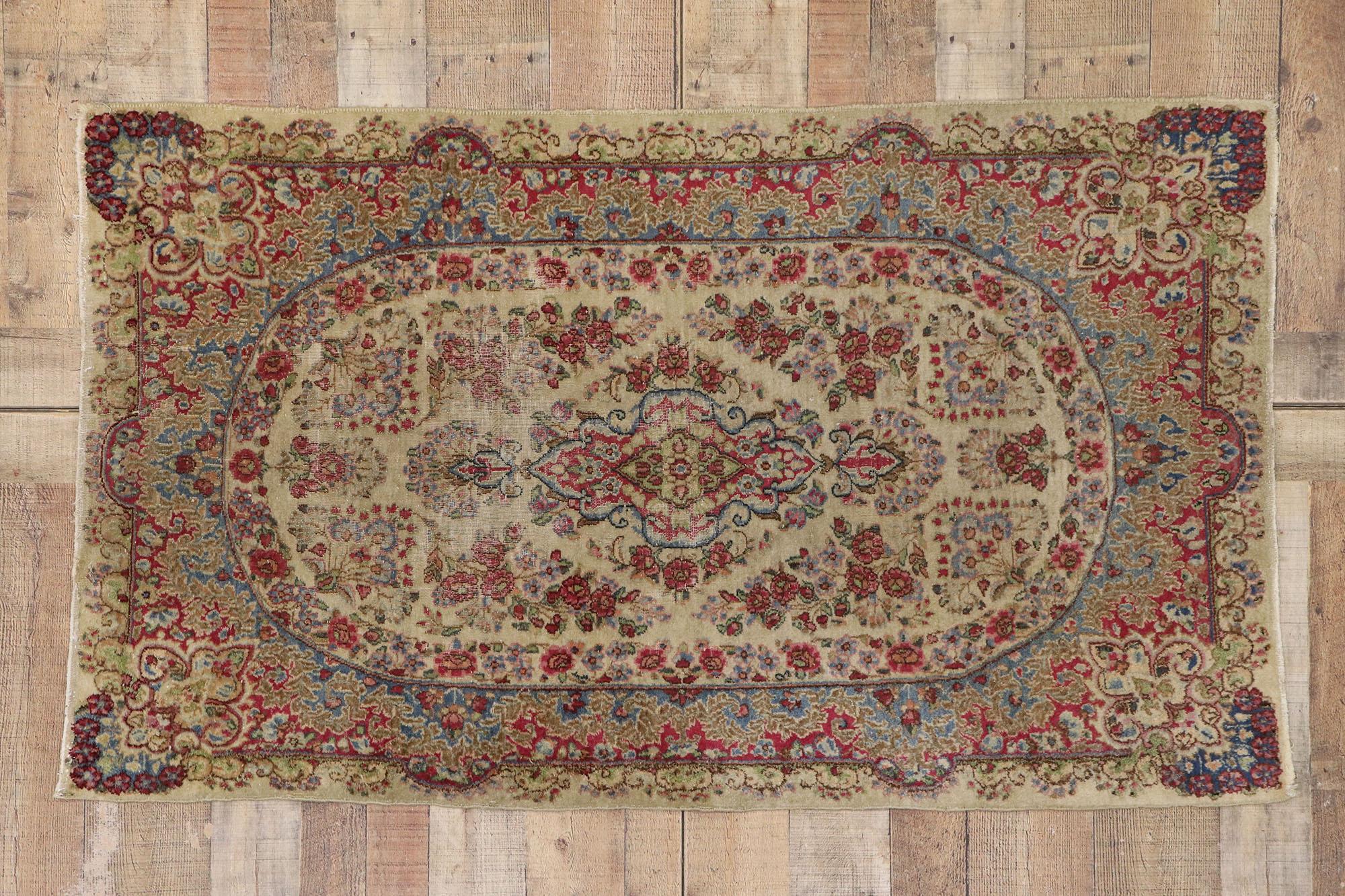 77560 distressed antique Persian Kerman rug with Shabby Chic Rustic French style. ??With an impressive array of realistic floral elements and a refined color palette, this hand knotted wool antique Persian Kerman rug charms with ease and beautifully