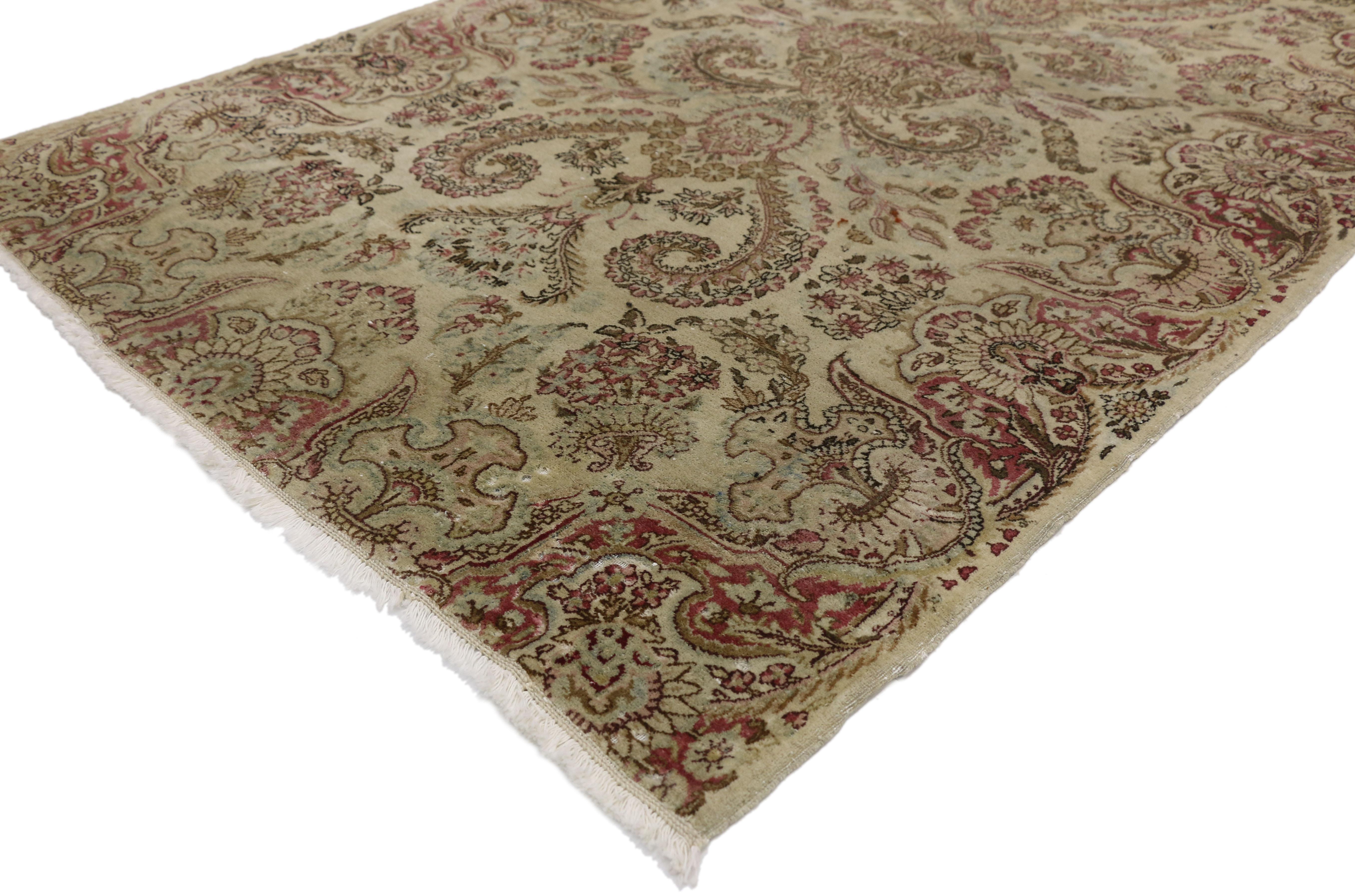 74282 Distressed Antique Persian Kerman with Shabby Chic Swedish Farmhouse Style. With an impressive array of realistic floral elements and lovingly timeworn appearance combined with harmonious and subtle hues, this hand knotted wool distressed