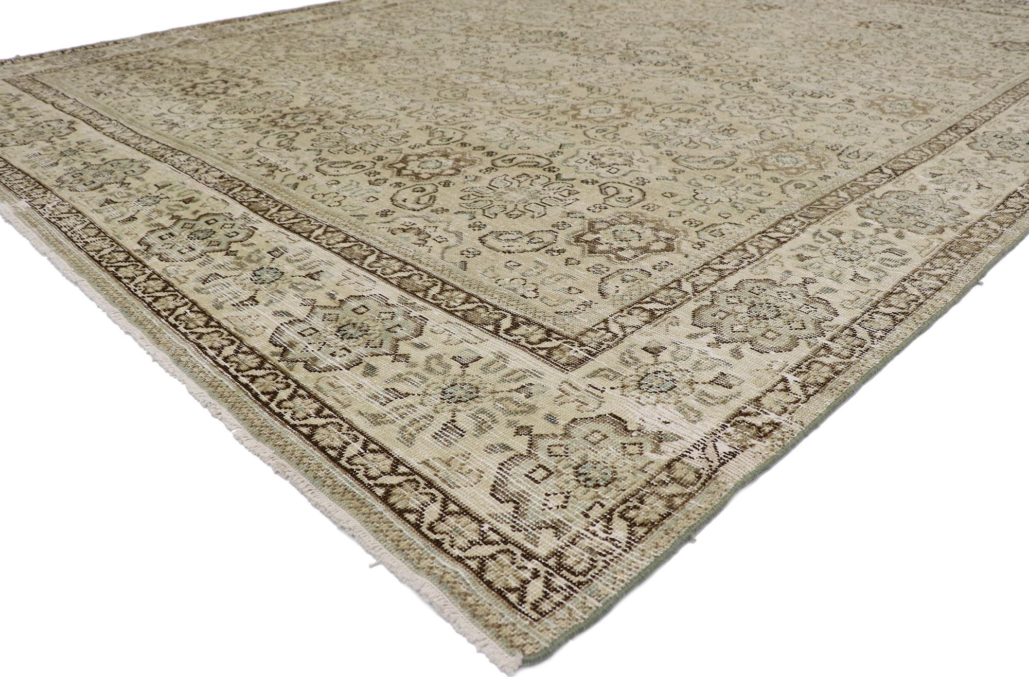 60930 distressed antique Persian Mahal rug 09'03 x 12'00. Cleverly composed and poised to impress with its rustic sensibility, this hand knotted wool distressed antique Persian Mahal rug will take on a curated lived-in look that feels timeless while