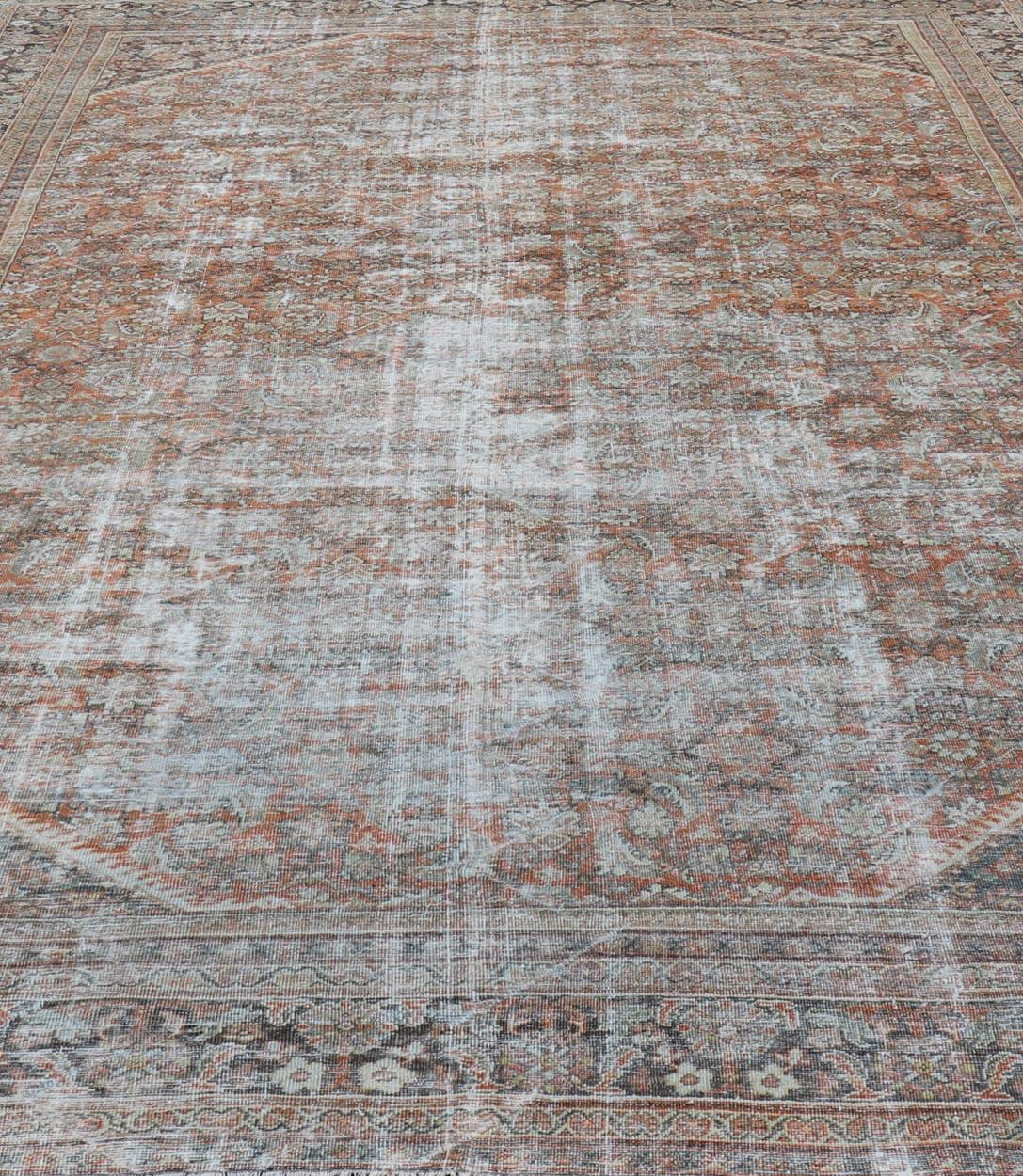Distressed Antique Persian Mahal Rug in Wool with Floral Design on a Red Field For Sale 4