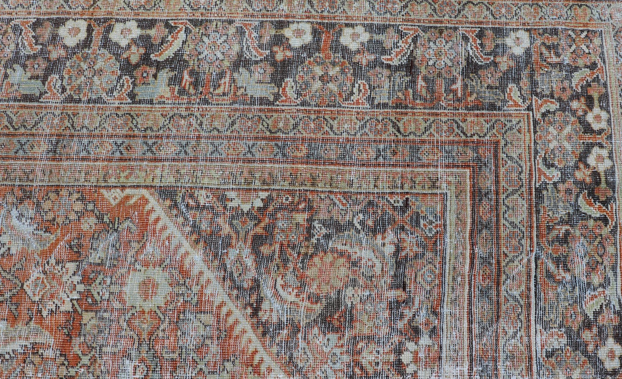 Distressed Antique Persian Mahal Rug in Wool with Floral Design on a Red Field For Sale 9