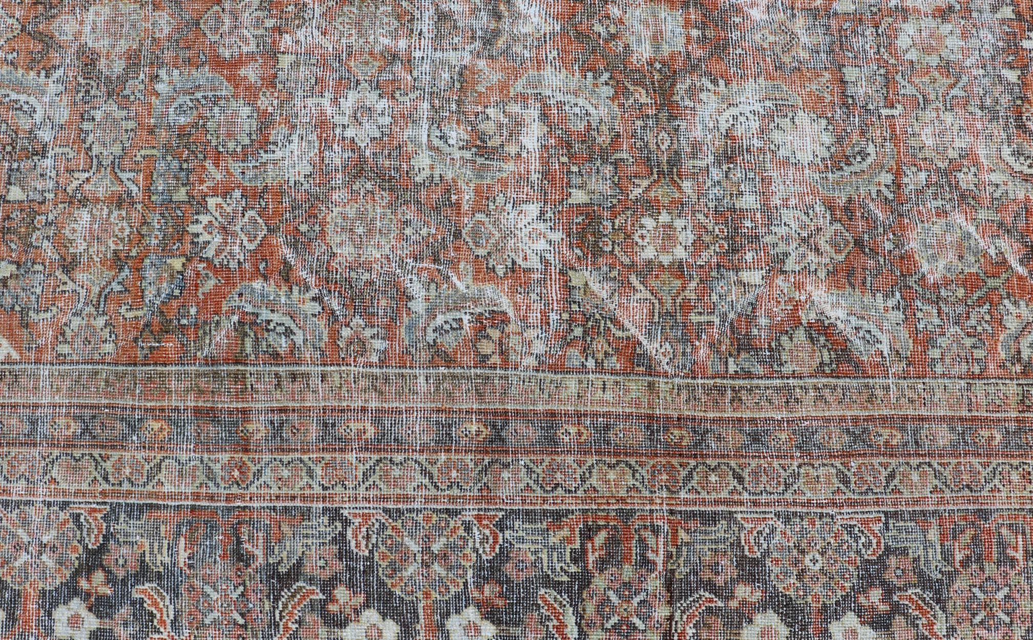 Sultanabad Distressed Antique Persian Mahal Rug in Wool with Floral Design on a Red Field For Sale