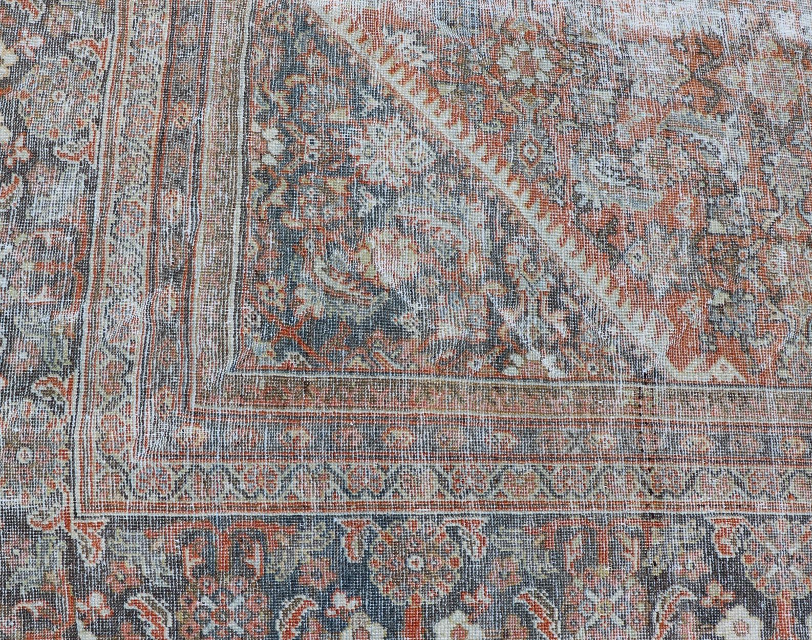 Hand-Knotted Distressed Antique Persian Mahal Rug in Wool with Floral Design on a Red Field For Sale