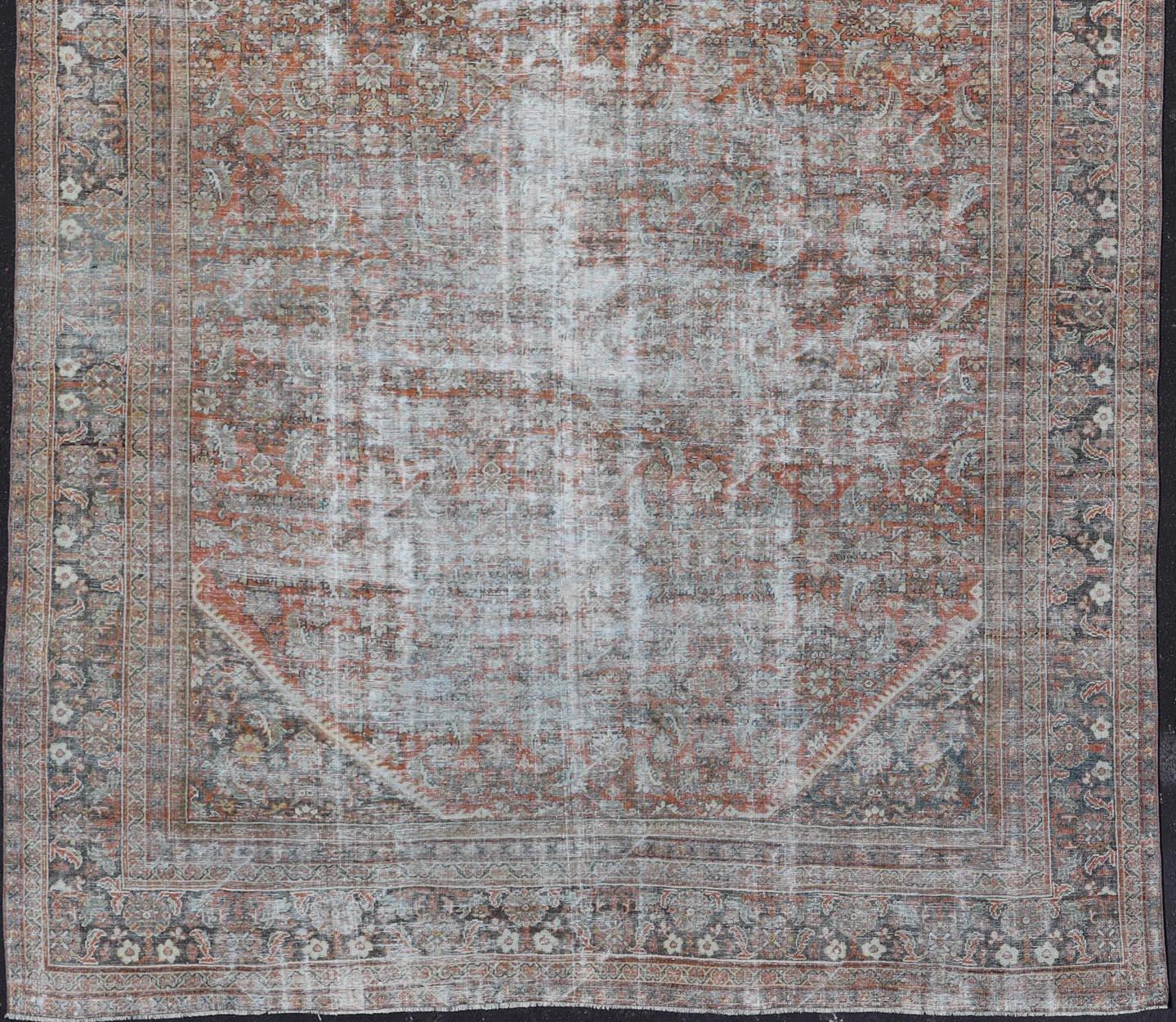 Distressed Antique Persian Mahal Rug in Wool with Floral Design on a Red Field For Sale 2