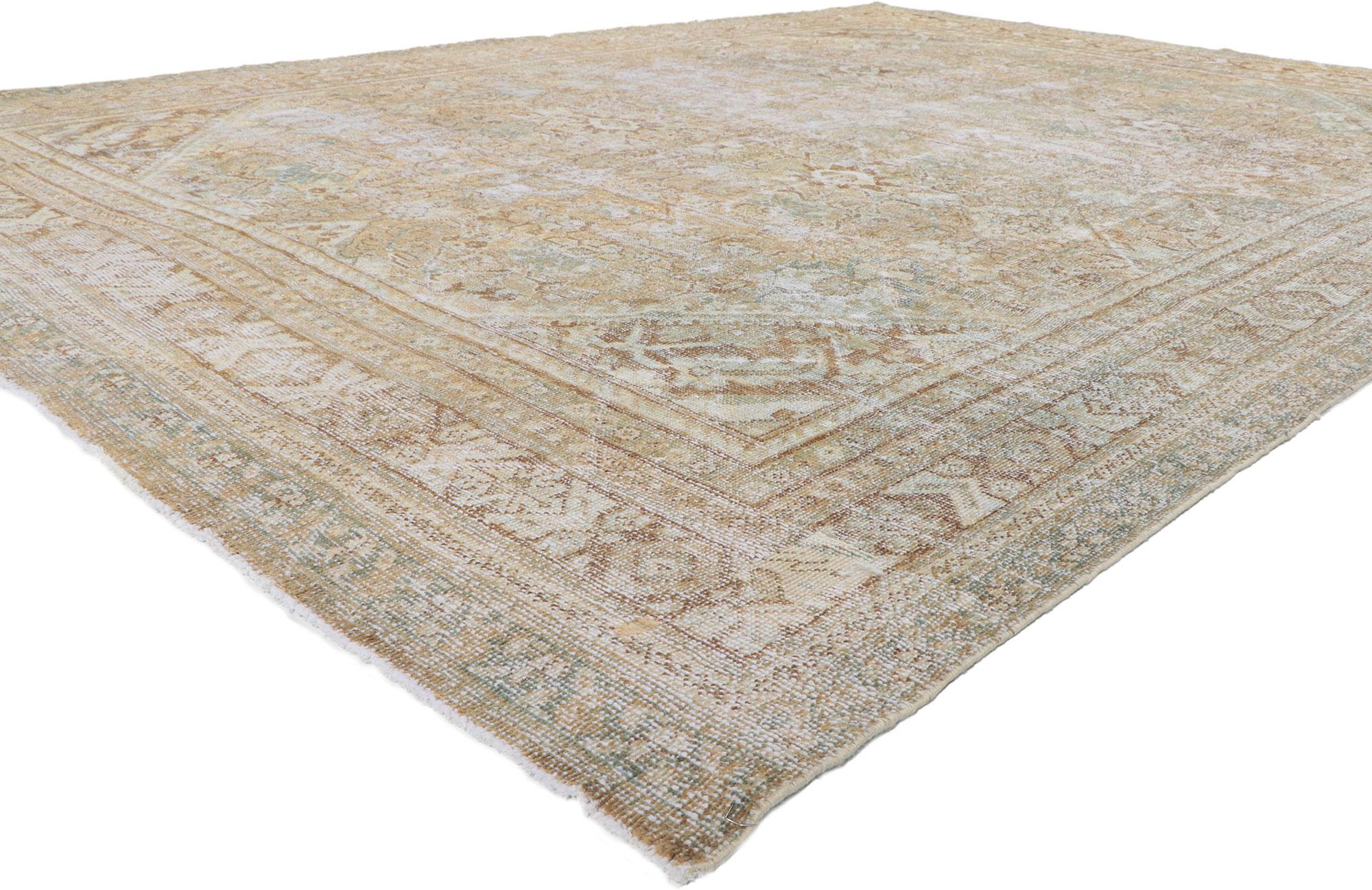 61170 distressed antique Persian mahal rug 09'00 x 12'06.
Emanating traditional sensibility and rugged beauty with an earthy colorway, this hand-knotted wool antique Persian Mahal rug creates an inimitable warmth and calming ambiance. The all-over