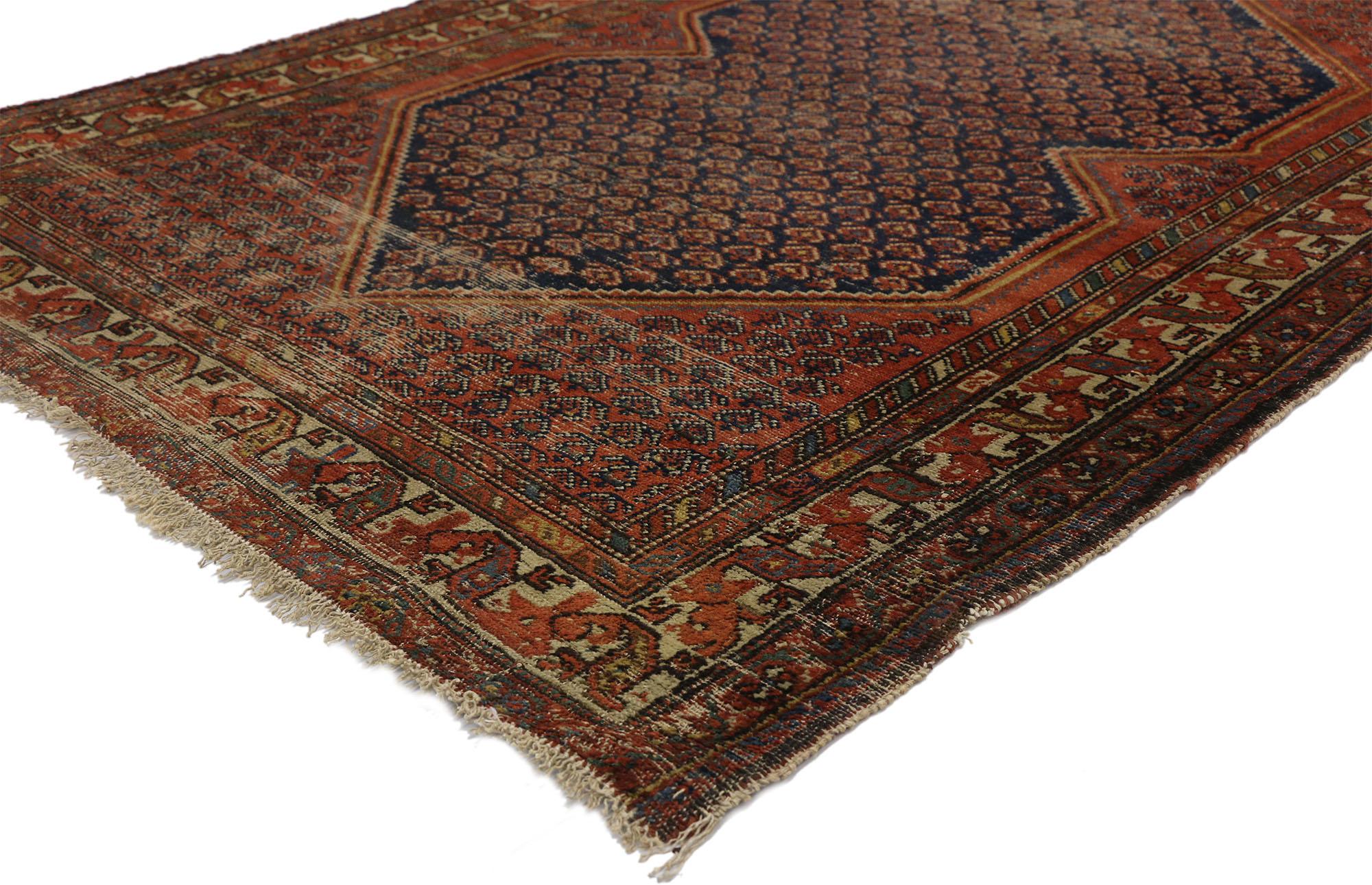 77251 distressed antique Persian Malayer rug with Rustic Artisan and Industrial style. With architectural elements combined with a weathered composition, this hand knotted wool antique Persian rug embodies a rustic Artisan style with MCM vibes. This