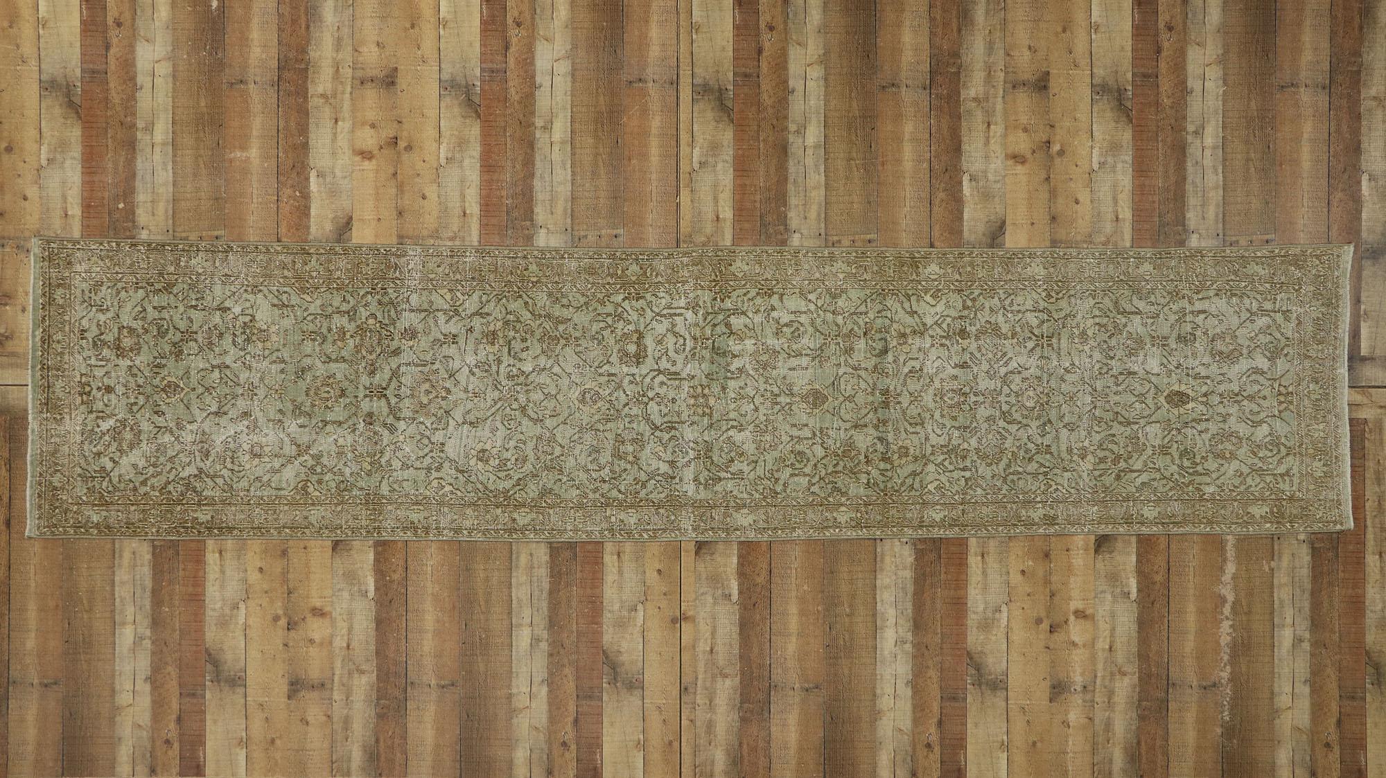 53235, distressed antique Persian Malayer Runner with Cotswold Countryside style. With a timeless botanical pattern and lovingly timeworn appearance, this hand knotted wool distressed antique Persian Malayer runner charms with ease and beautifully