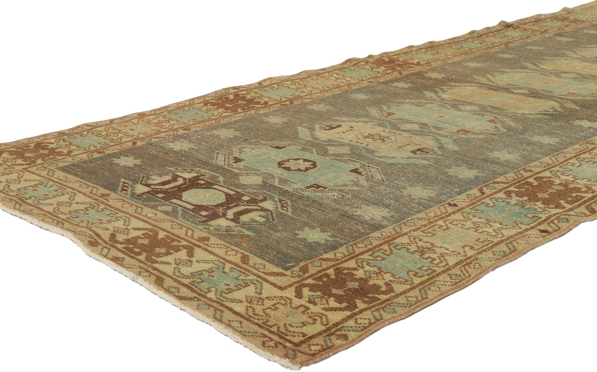 53767 distressed antique Persian malayer runner with Scarab design 03'08 x 13'06. Full of tiny details and a bold expressive design combined with an earthy colorway and tribal style, this hand-knotted wool distressed antique Persian Malayer runner