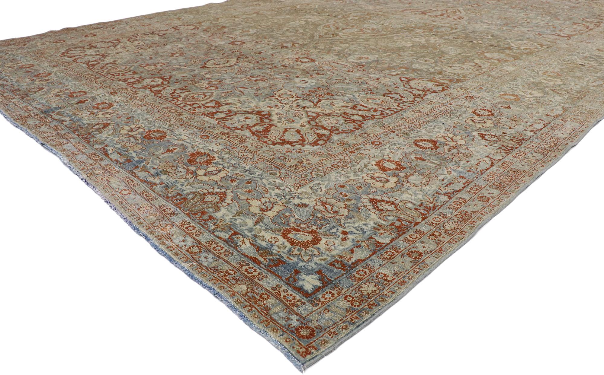 53389 Antique Persian Mashhad Rug Hotel Lobby Size Carpet 10'11 x 17'08. With a timeless botanical pattern and lovingly timeworn appearance, this hand knotted wool distressed antique Persian Mashhad rug will take on a curated lived-in look that
