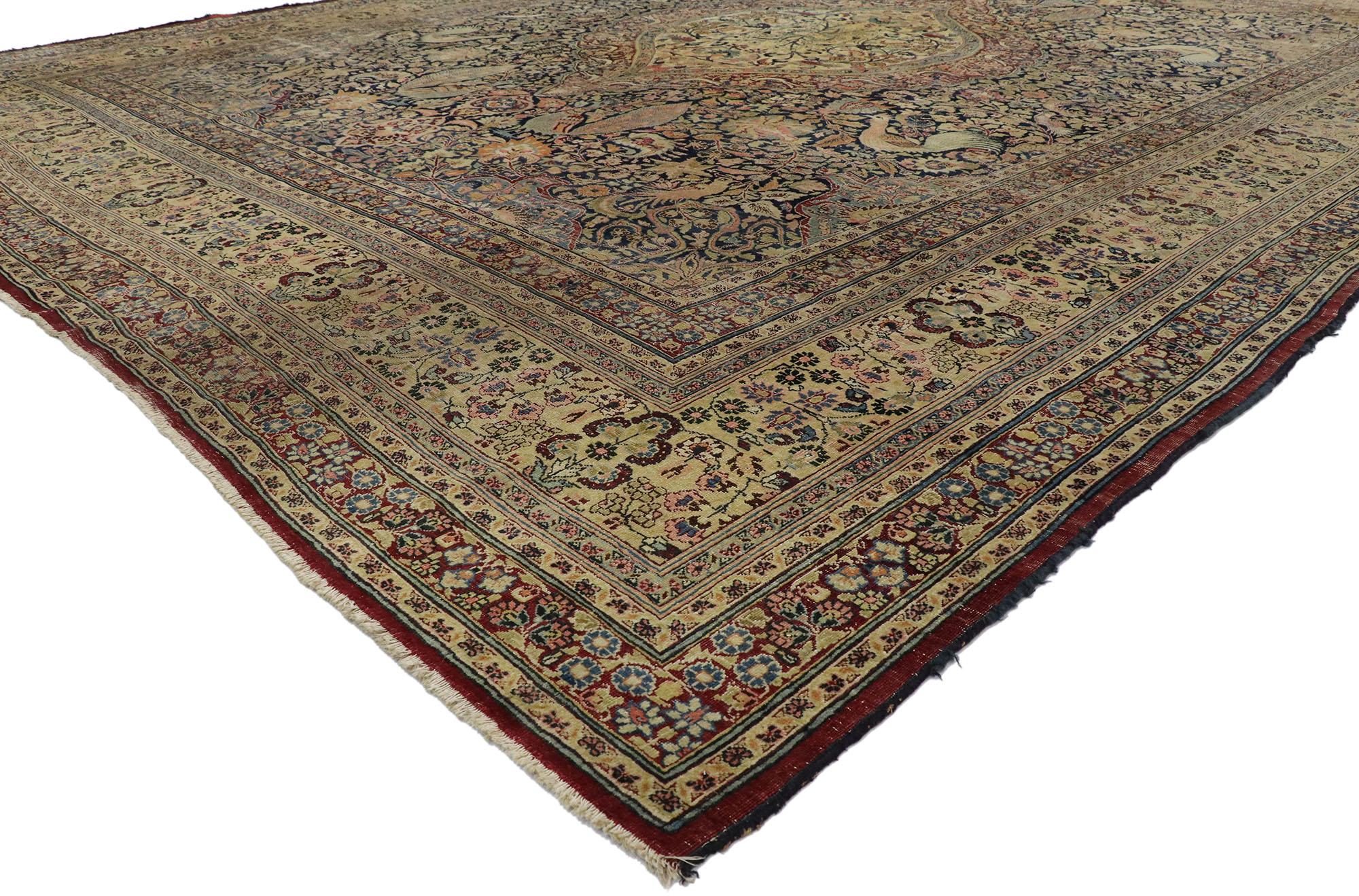 77569, distressed antique Persian Mashhad rug with Garden design and rustic English style. Cleverly composed and distinctively well-balanced, this hand knotted wool distressed antique Persian Mashhad rug will take on a curated lived-in look that