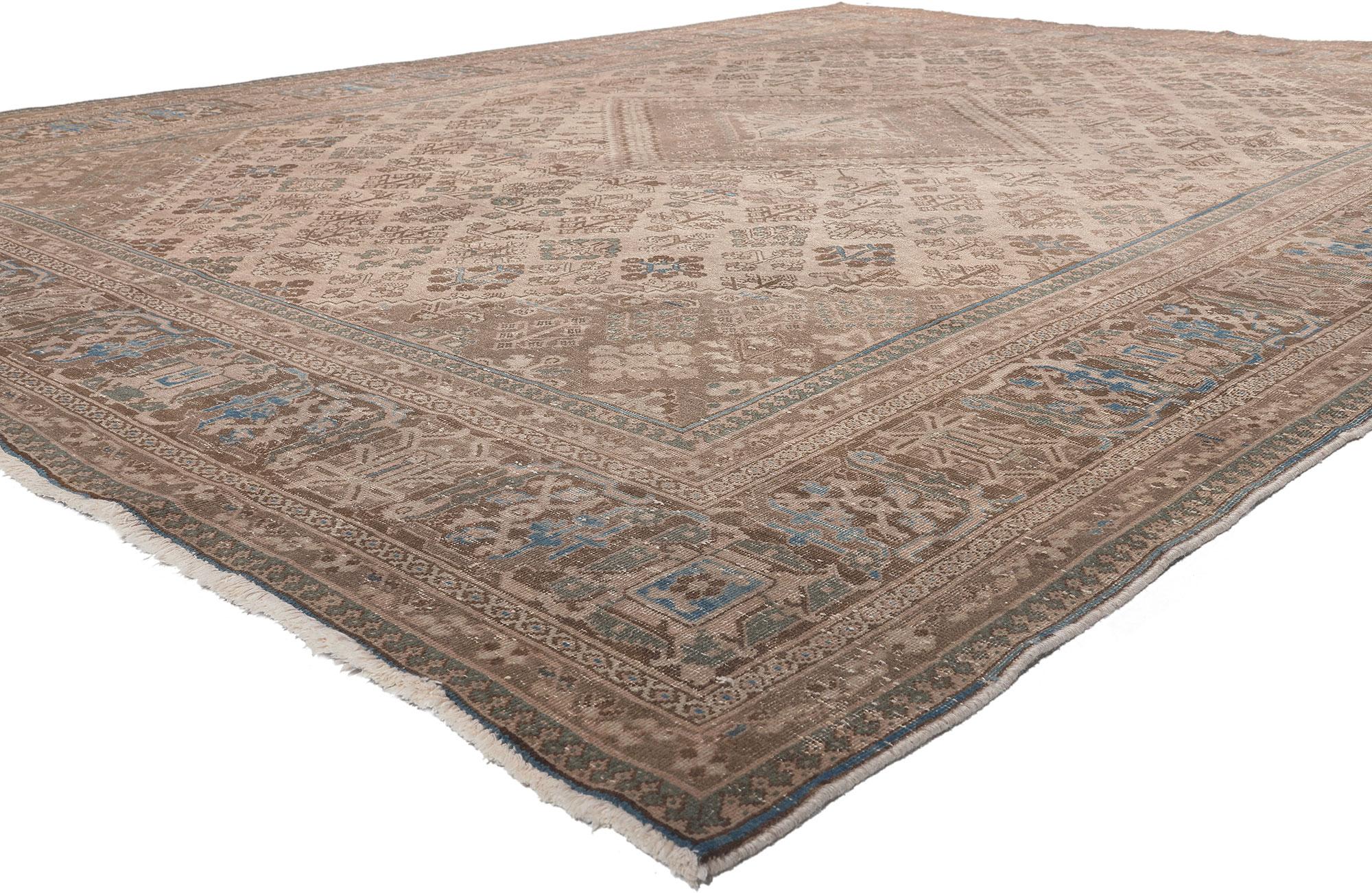 78597 Distressed Antique Persian Joshegan Rug, 10'00 x 13'06. 
Traditional sensibility meets effortlessly chic in this distressed vintage Persian Joshegan rug. The intricate botanical design and muted earthy hues woven into this piece work together