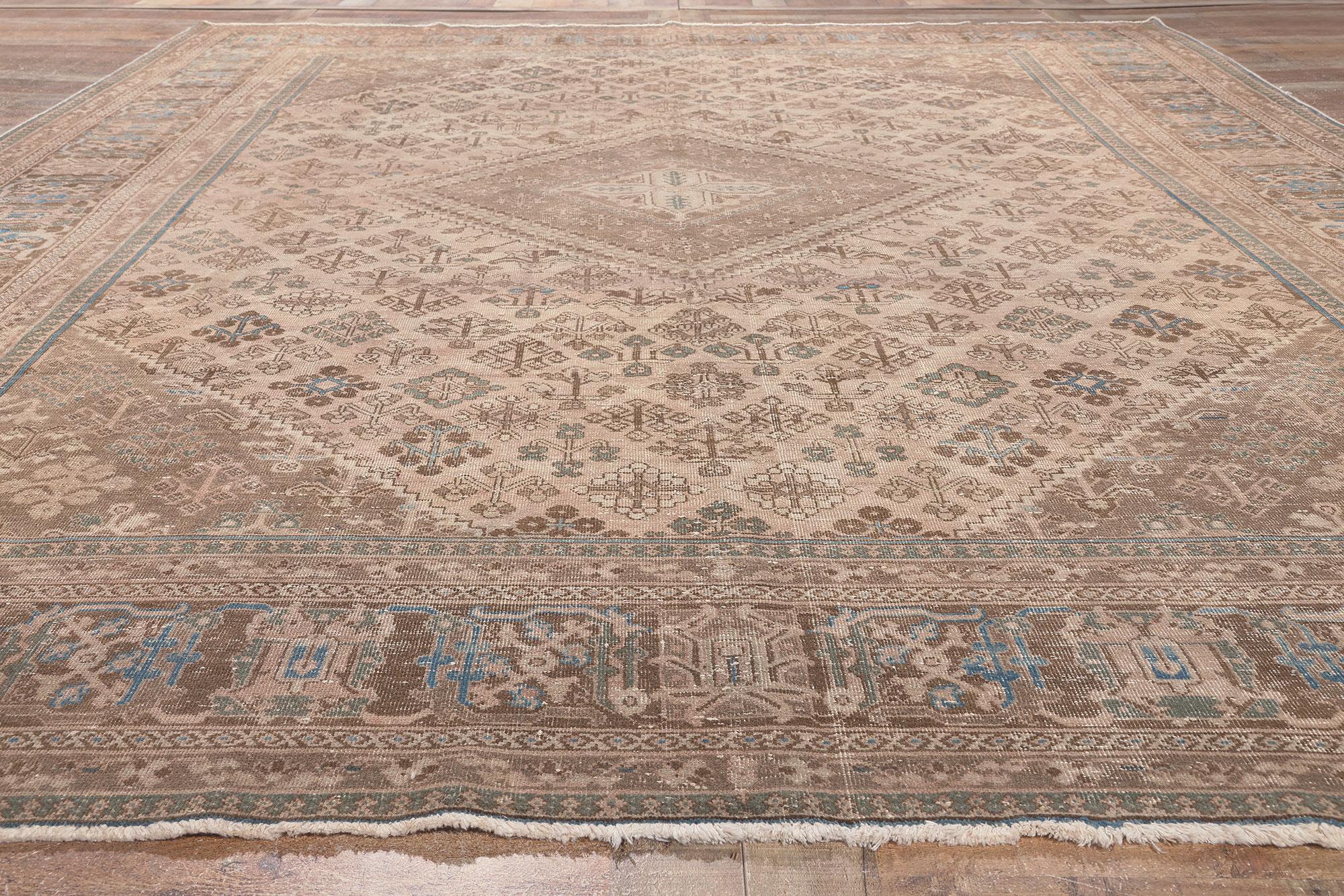 Wool Distressed Antique Persian Rug, Understated Elegance Meets Relaxed Familiarity For Sale