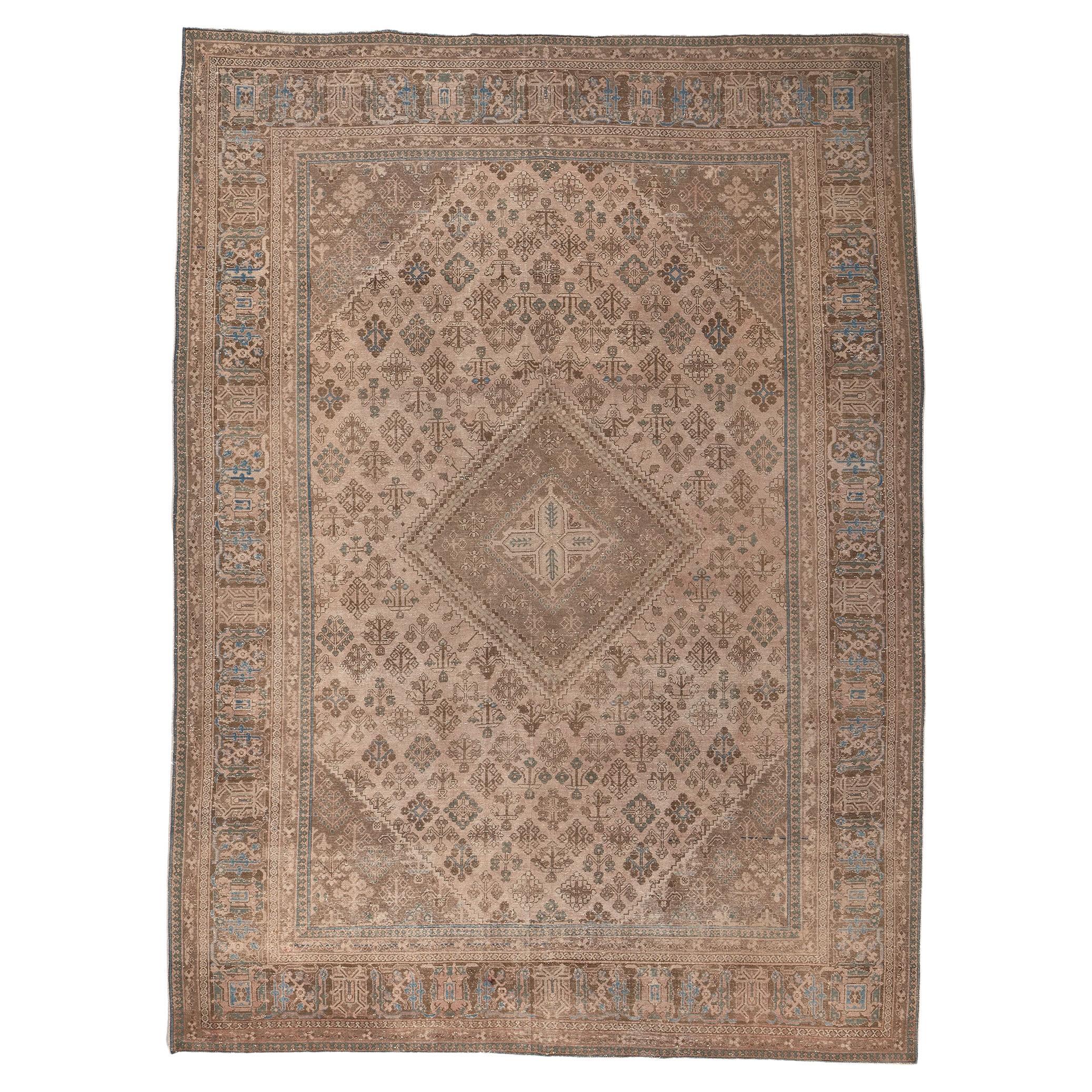 Distressed Antique Persian Rug, Understated Elegance Meets Relaxed Familiarity For Sale