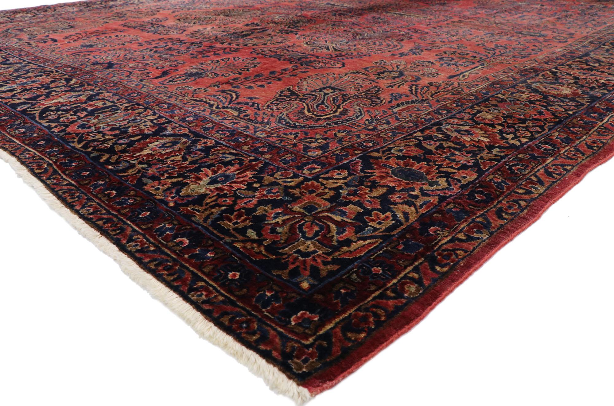77387, distressed antique Persian Sarouk Area rug with Modern English Tudor style. Rich colors yet lovingly timeworn with beguiling ambiance, this hand knotted wool distressed antique Persian Sarouk area rug beautifully highlights modern English