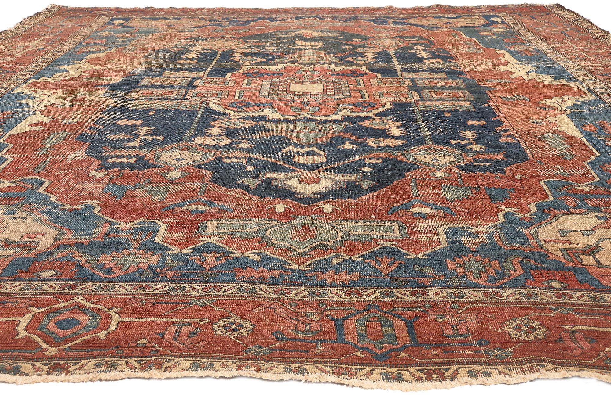 Distressed Antique Persian Serapi Rug, Rugged Beauty Meets Weathered Charm In Distressed Condition For Sale In Dallas, TX