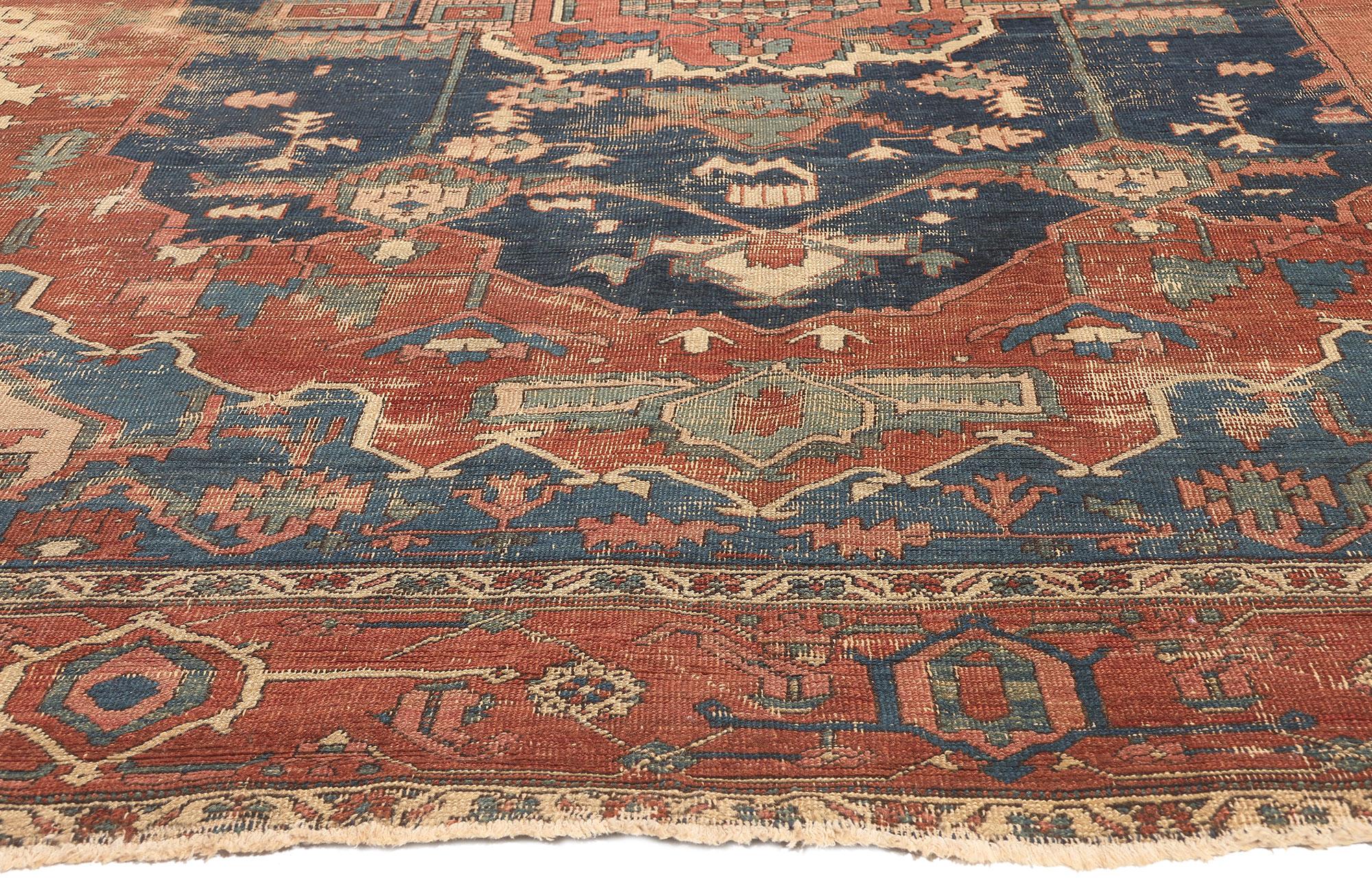 Wool Distressed Antique Persian Serapi Rug, Rugged Beauty Meets Weathered Charm For Sale