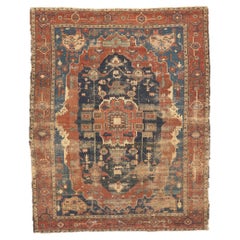 Distressed Antique Persian Serapi Rug, Rugged Beauty Meets Weathered Charm