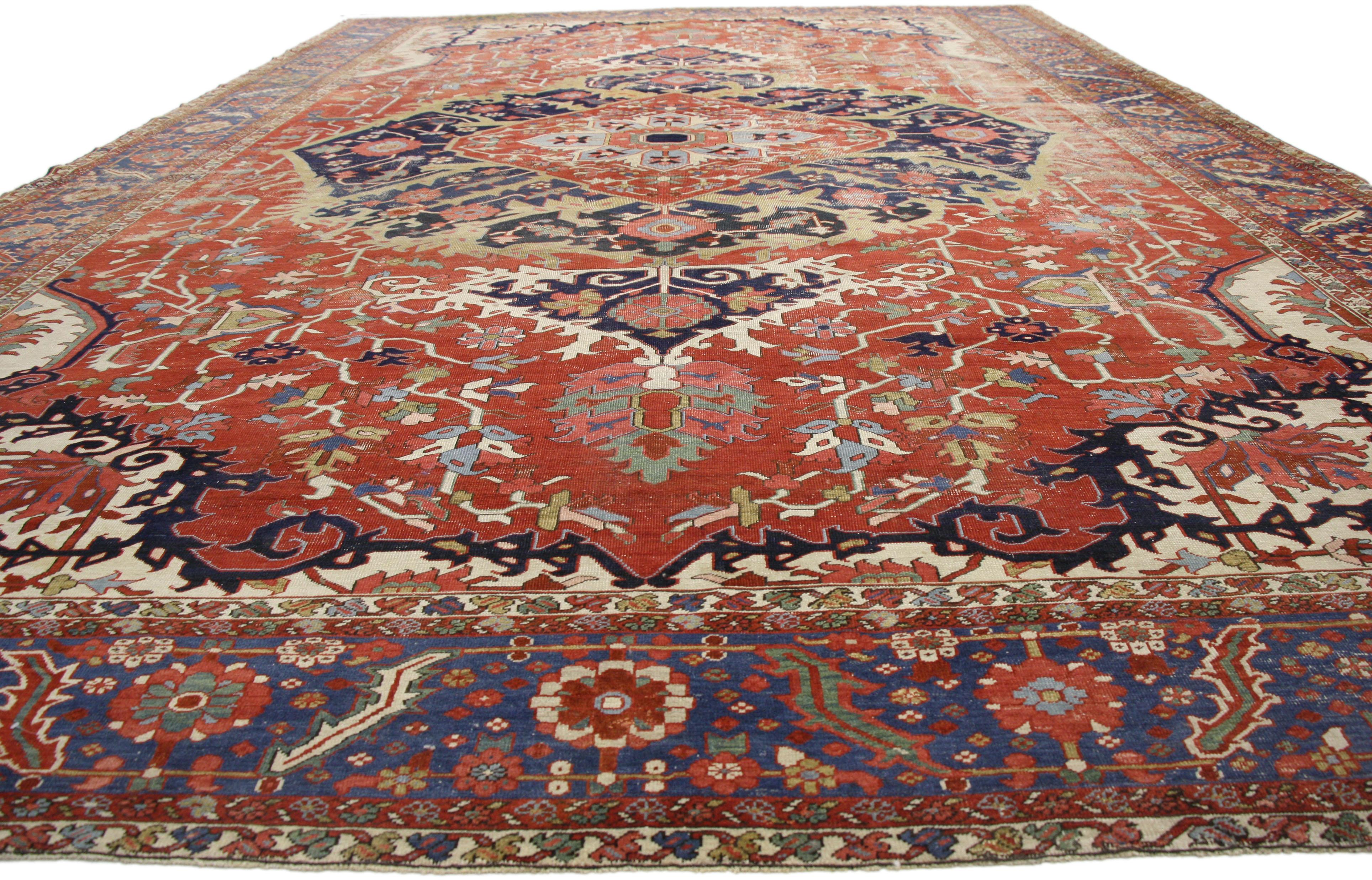 52303 Distressed Antique-Worn Persian Serapi Rug, 13'00 x 19'10. 
With timeless appeal, refined colors, and architectural design elements, this hand knotted wool distressed antique Persian Serapi palace rug can beautifully blend contemporary and