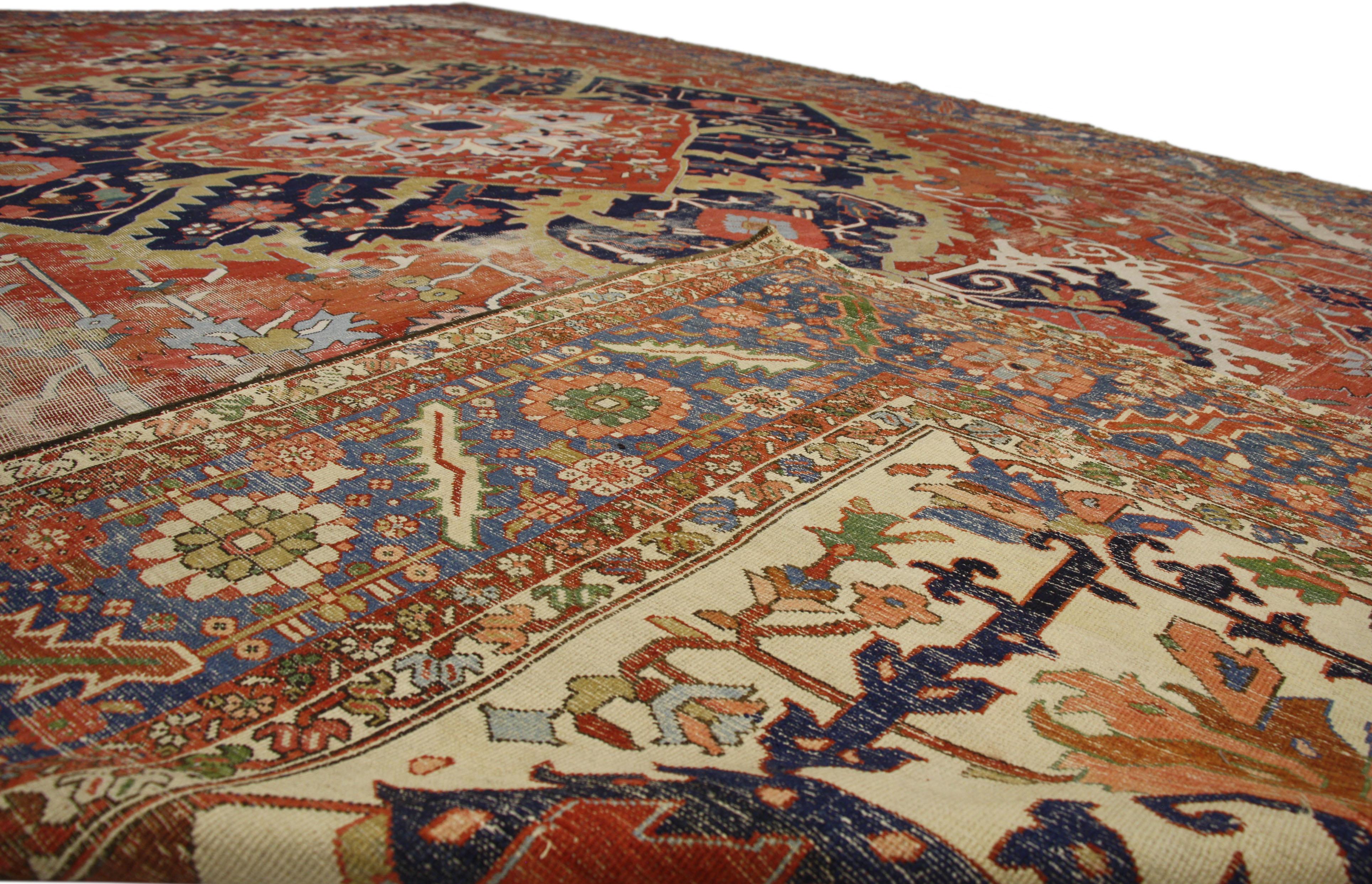 20th Century Antique-Worn Persian Serapi Rug, Rustic Charm Meets Relaxed Refinement For Sale