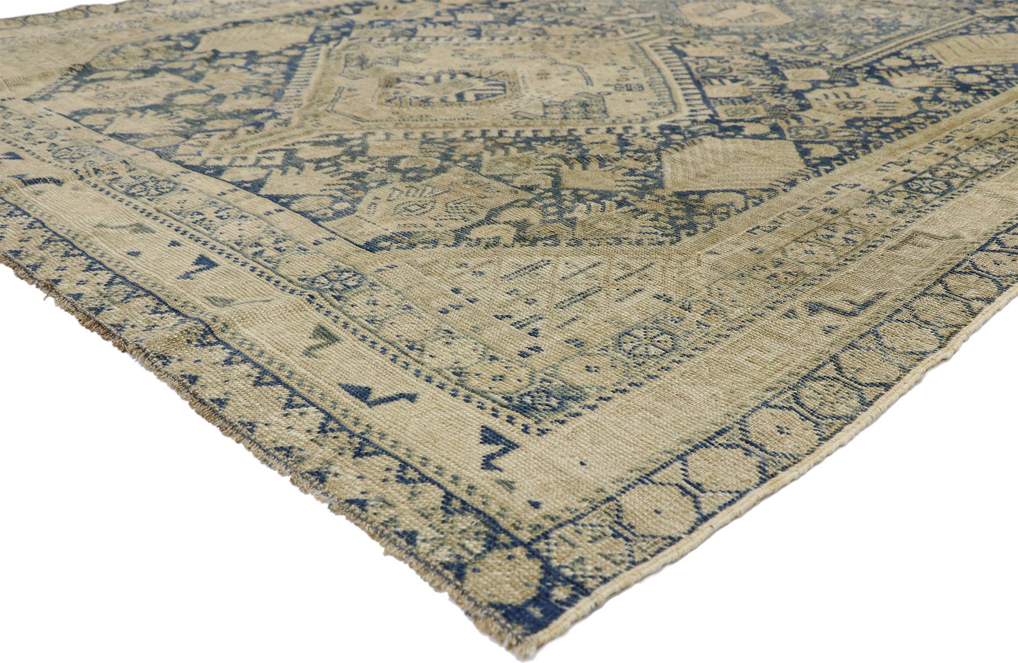 52631, distressed antique Persian Shiraz design rug with British Colonial style. Warm and inviting combined with the right amount of necessary aesthetic elements, this hand knotted wool distressed antique Persian Shiraz design rug charms with ease