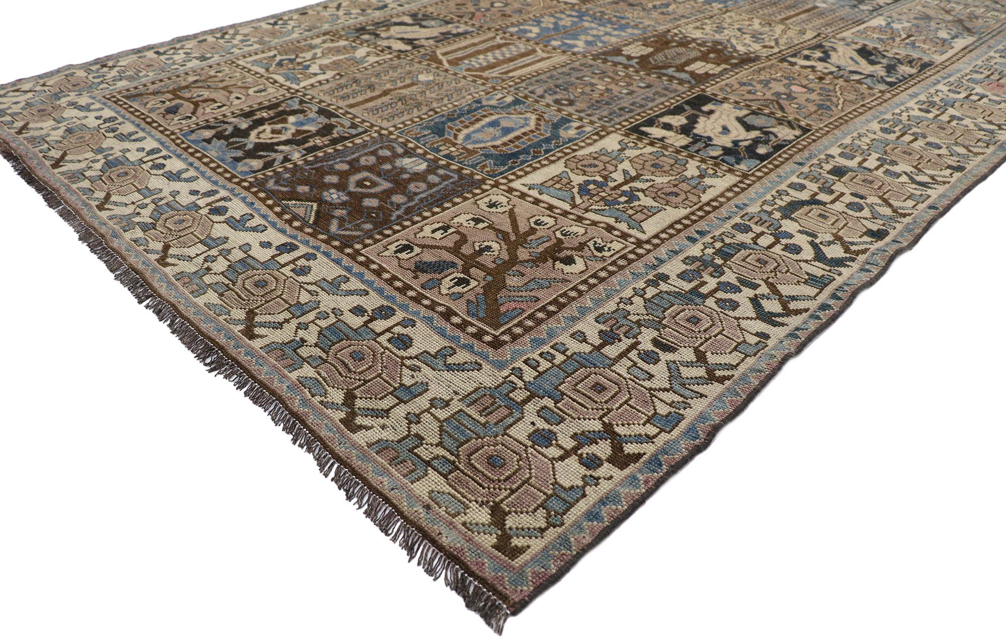 60821, distressed antique Persian Shiraz rug with Garden Panel Four Seasons design. Cleverly composed and distinctively well-balanced, this hand knotted wool distressed antique Persian Shiraz rug will take on a curated lived-in look that feels
