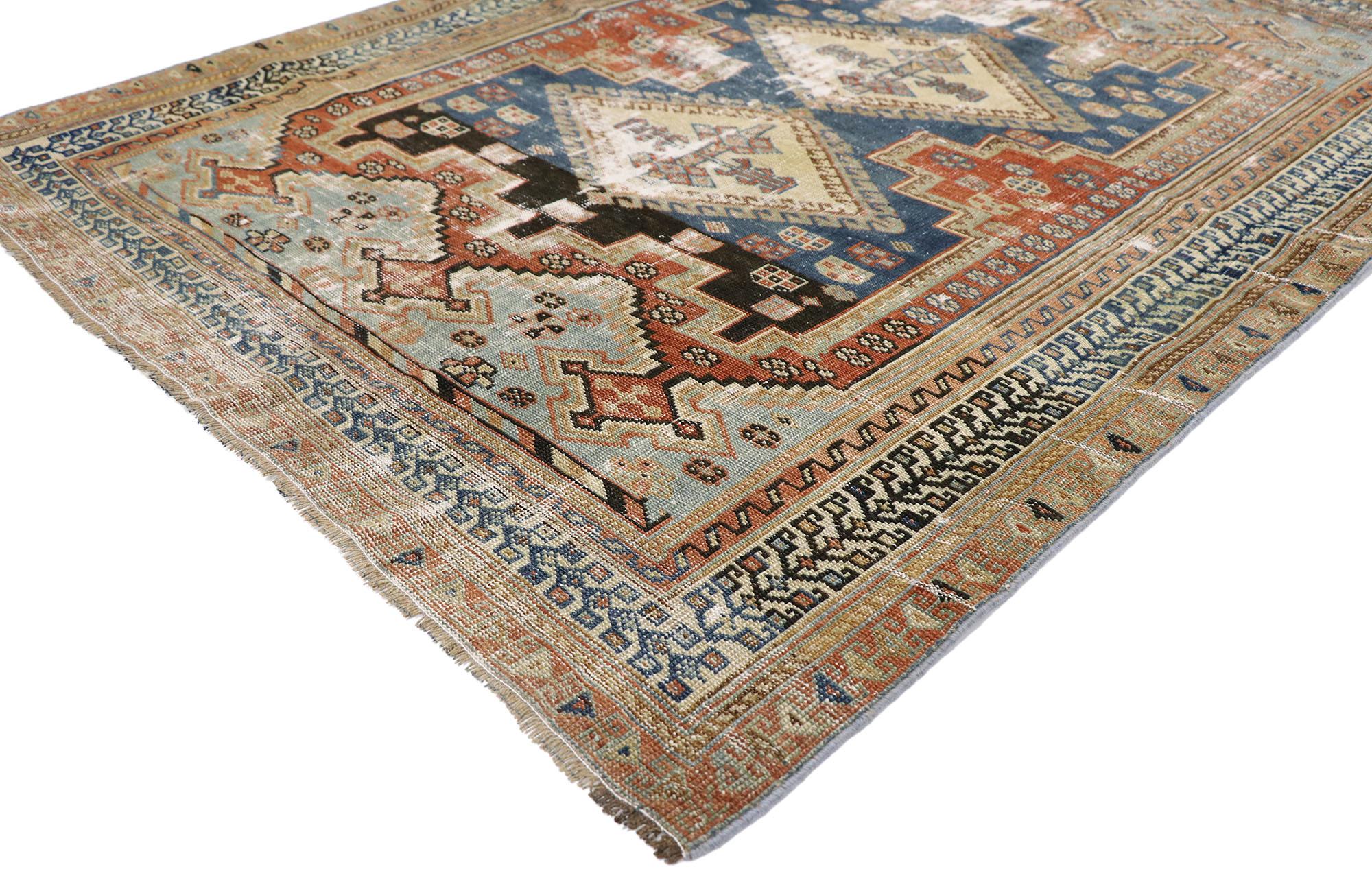 60897, distressed antique Persian Shiraz rug with Modern Rustic Tribal style. Emanating sophistication and nomadic charm with rustic sensibility, this hand knotted wool distressed antique Persian Shiraz rug beautifully embodies a modern tribal