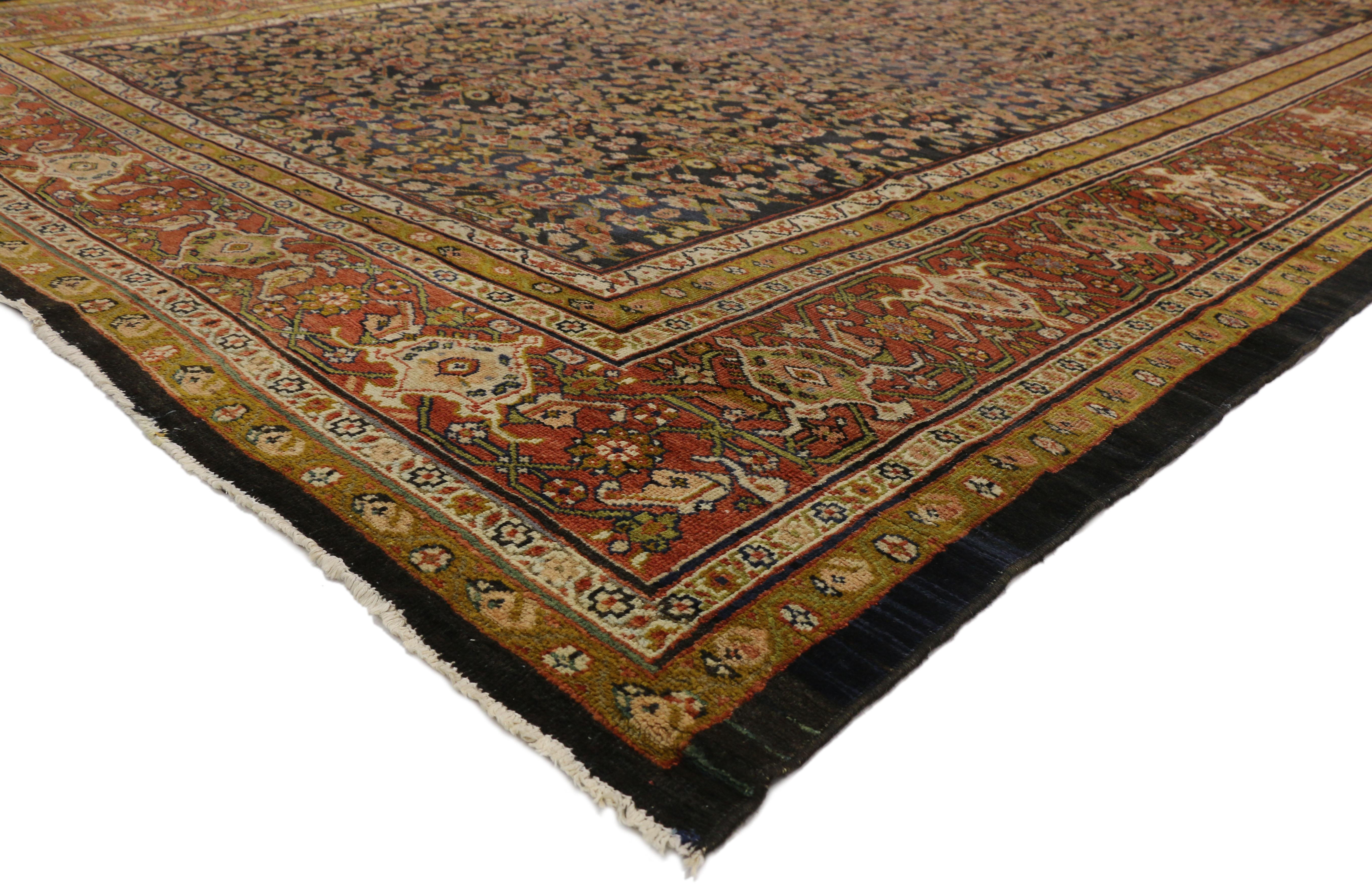 74217 Distressed Antique Persian Sultanabad Palace rug with Industrial Artisan style. This hand knotted wool antique Persian Sultanabad palace size rug features a lively all-over floral lattice pattern composed of Mina Khani design and Guli Henna