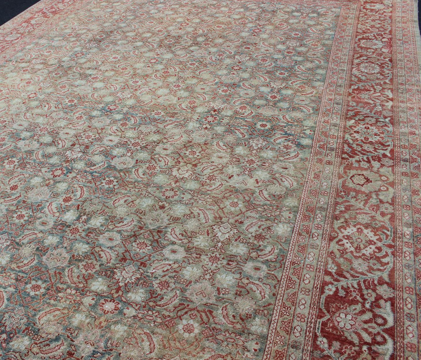 Distressed Antique Persian Sultanabad Rug in Faded Blue Background For Sale 1