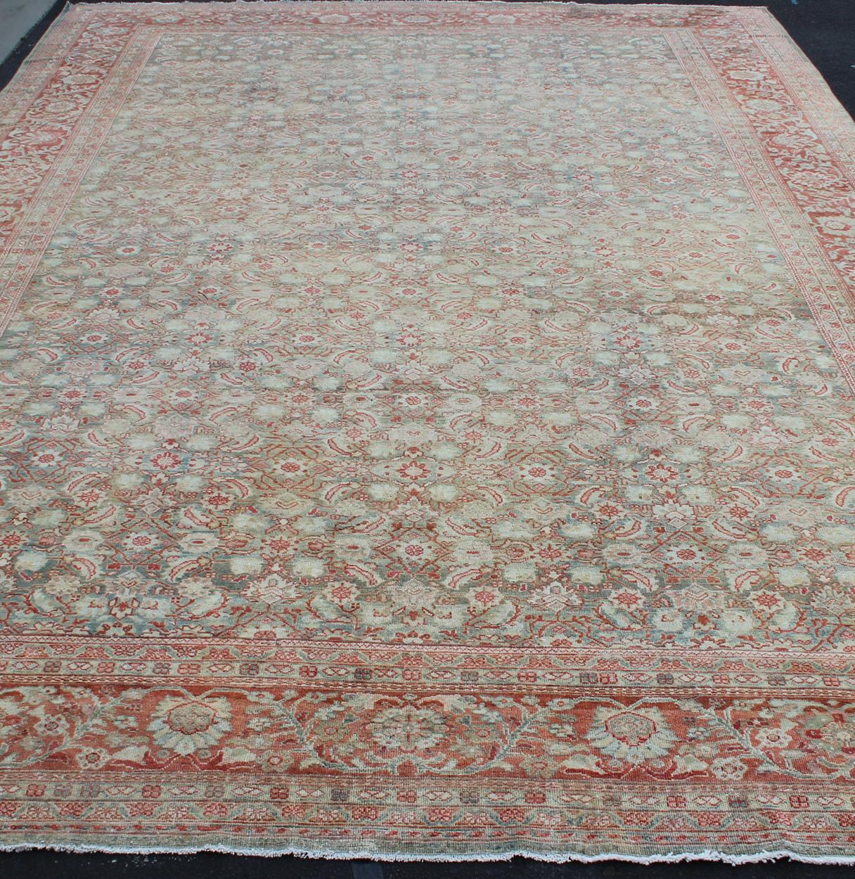 Distressed Antique Persian Sultanabad Rug in Faded Blue Background In Good Condition For Sale In Atlanta, GA