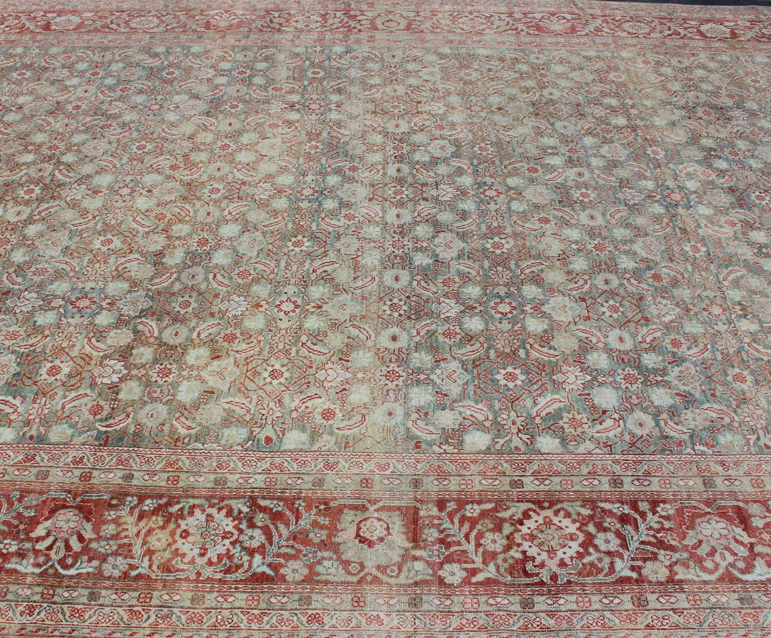 20th Century Distressed Antique Persian Sultanabad Rug in Faded Blue Background For Sale