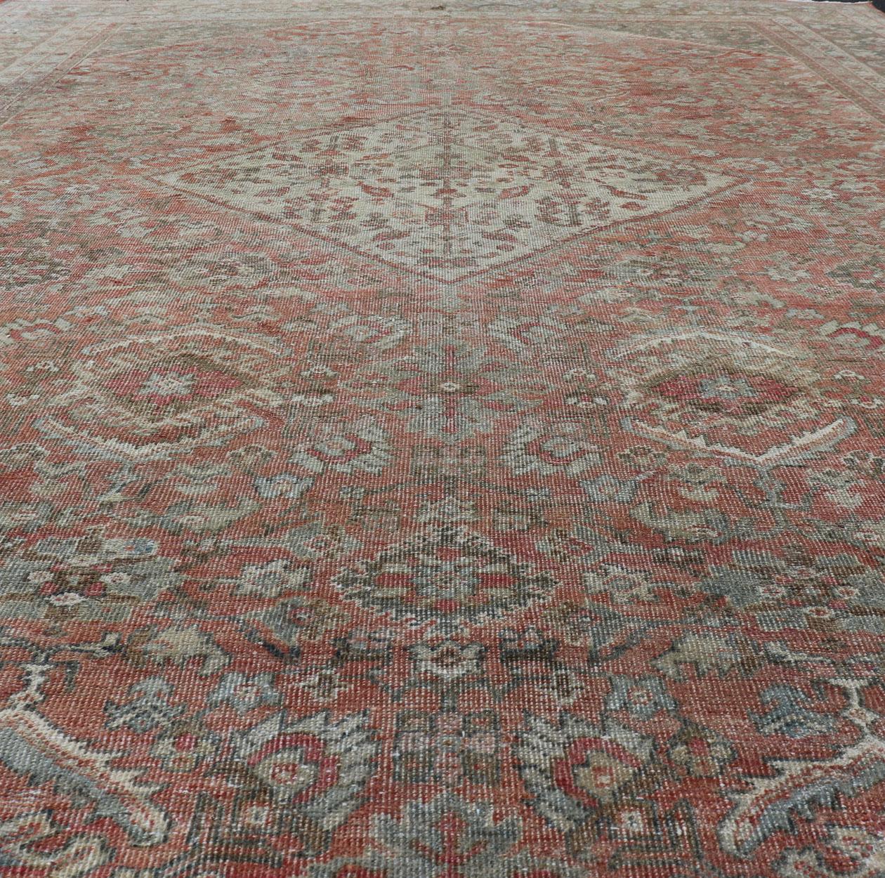 Distressed Antique Sultanabad Rug in Faded Red Background, Charcoal Border For Sale 4