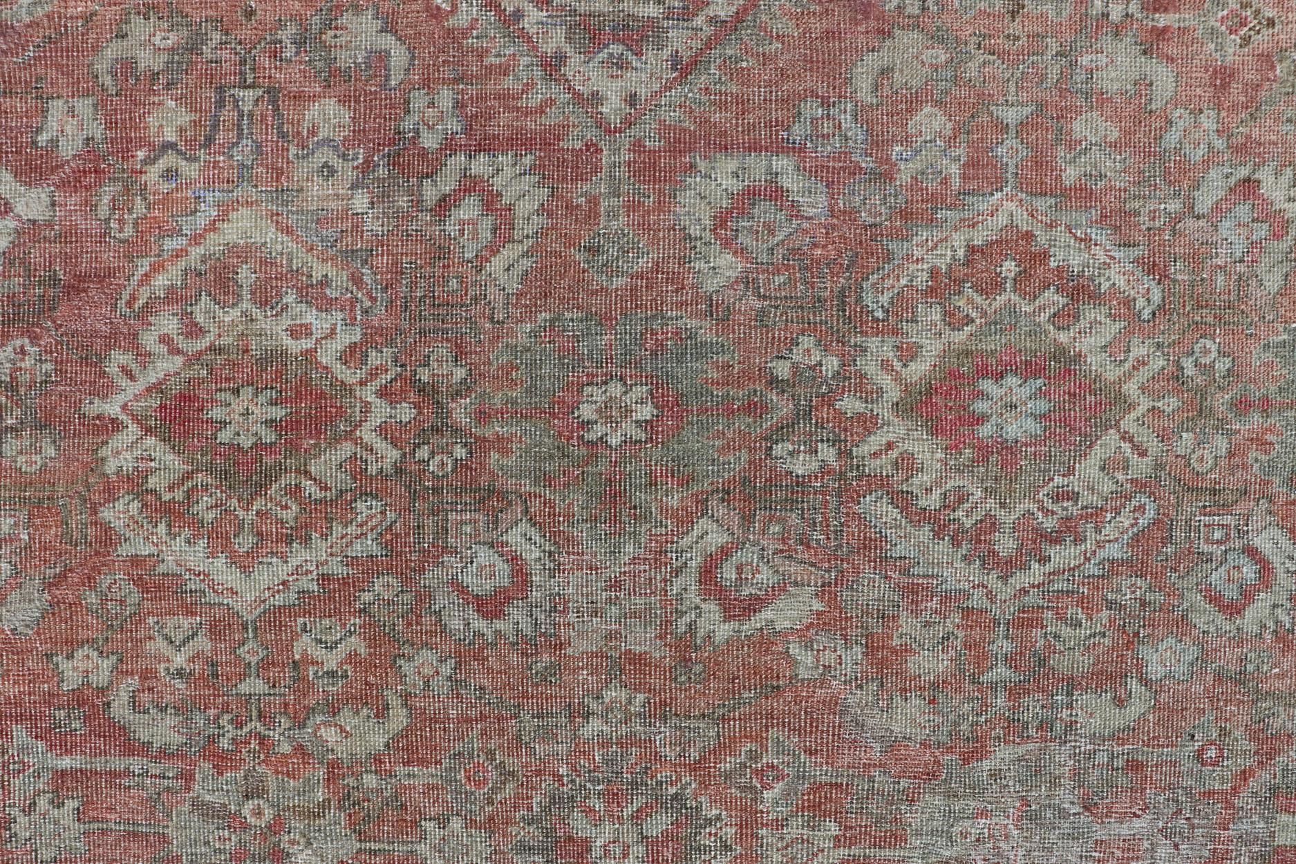Distressed Antique Sultanabad Rug in Faded Red Background, Charcoal Border For Sale 6