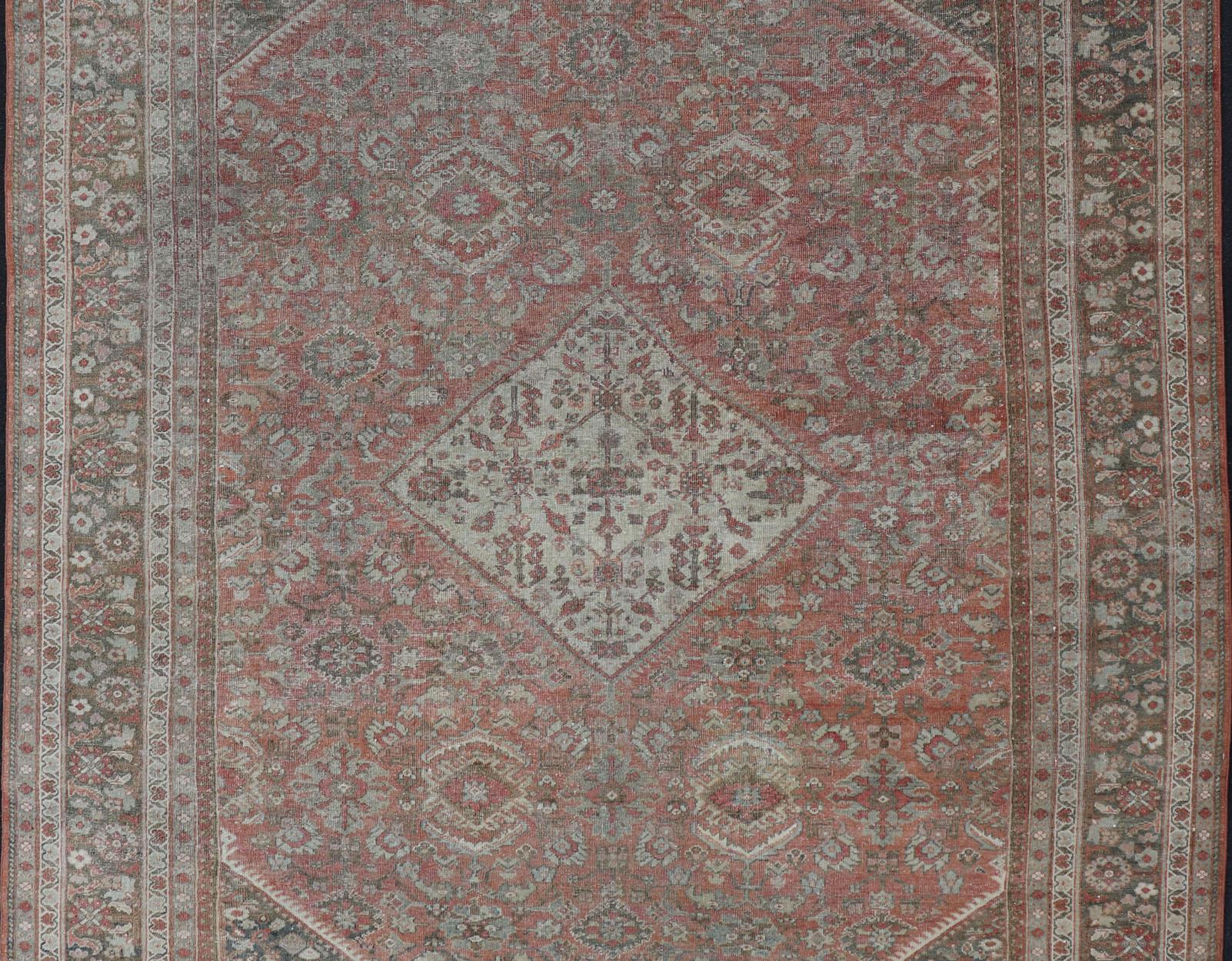 Persian Distressed Antique Sultanabad Rug in Faded Red Background, Charcoal Border For Sale