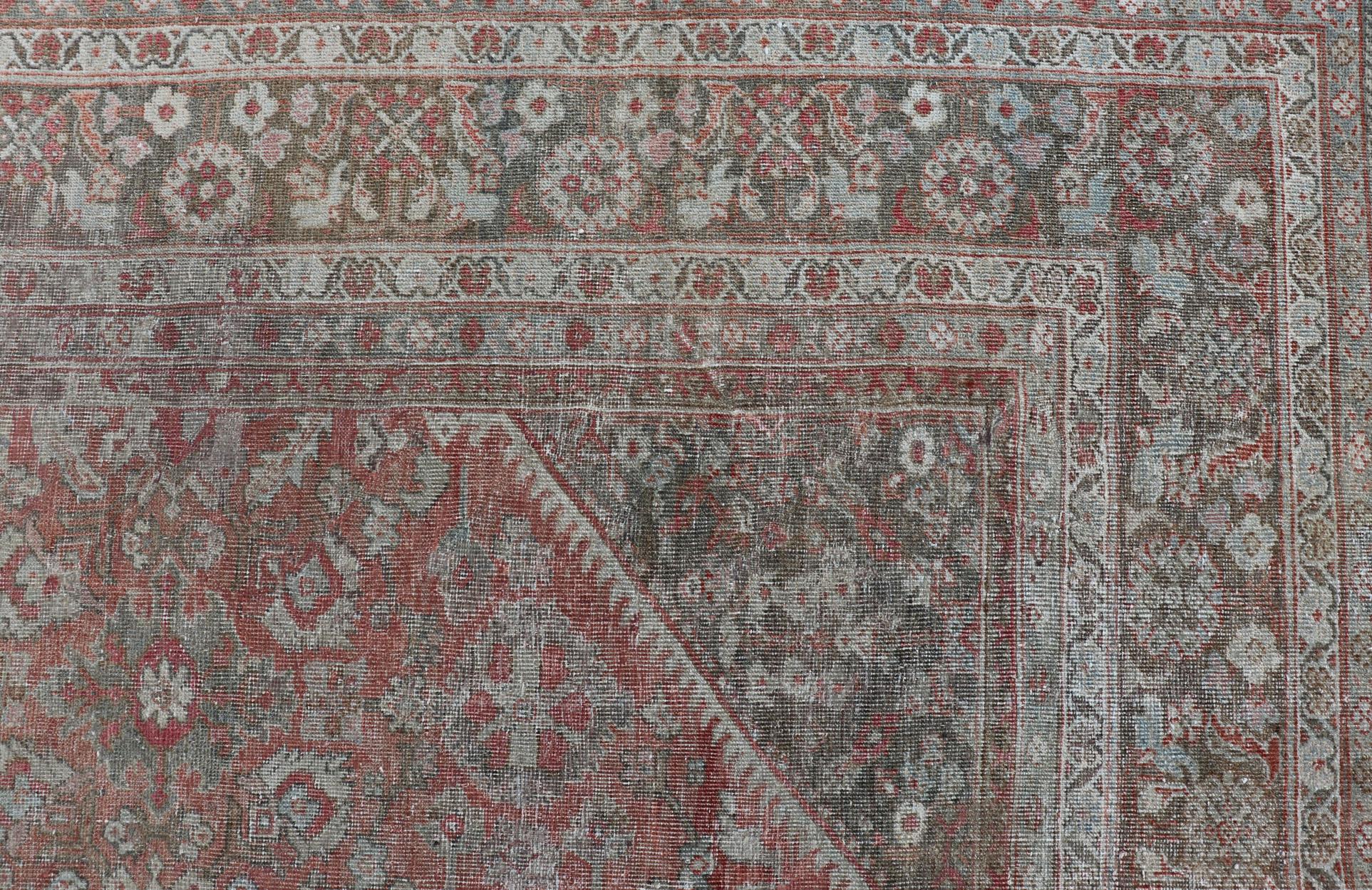Distressed Antique Sultanabad Rug in Faded Red Background, Charcoal Border In Fair Condition For Sale In Atlanta, GA