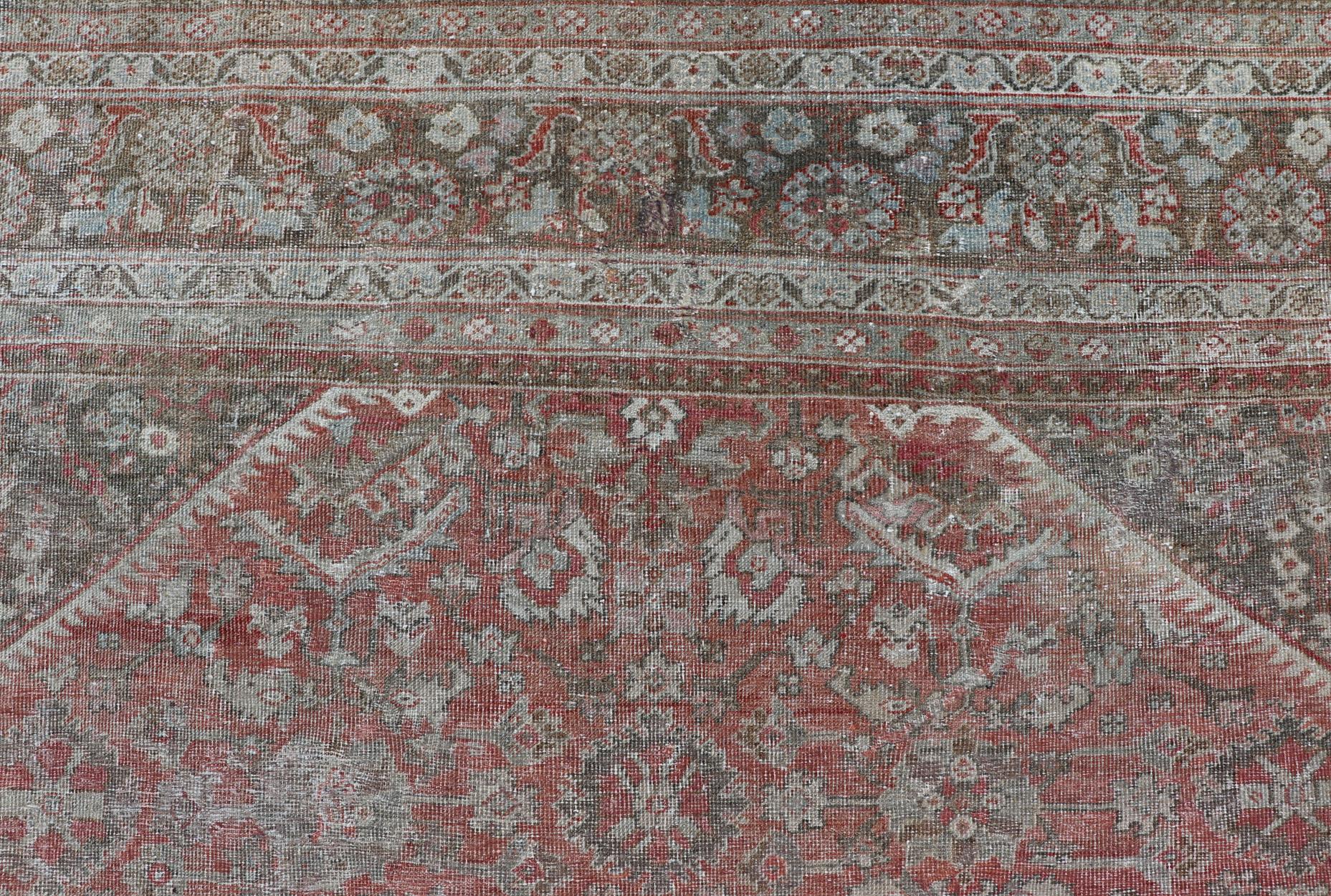 Wool Distressed Antique Sultanabad Rug in Faded Red Background, Charcoal Border For Sale