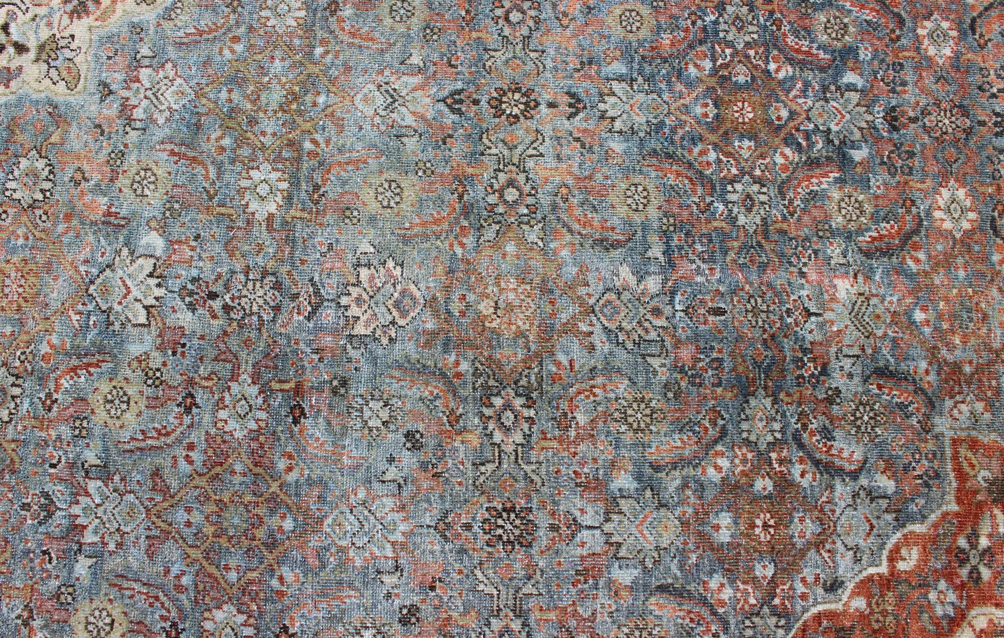 20th Century Distressed Antique Persian Sultanabad Rug in Steel Blue Background, Green, Red For Sale