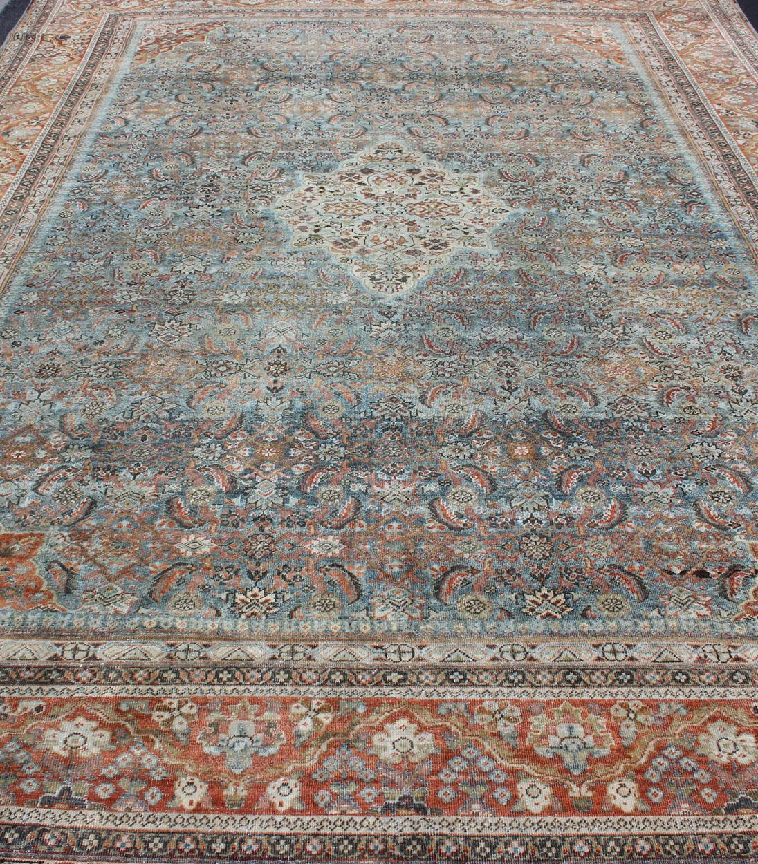 Wool Distressed Antique Persian Sultanabad Rug in Steel Blue Background, Green, Red For Sale