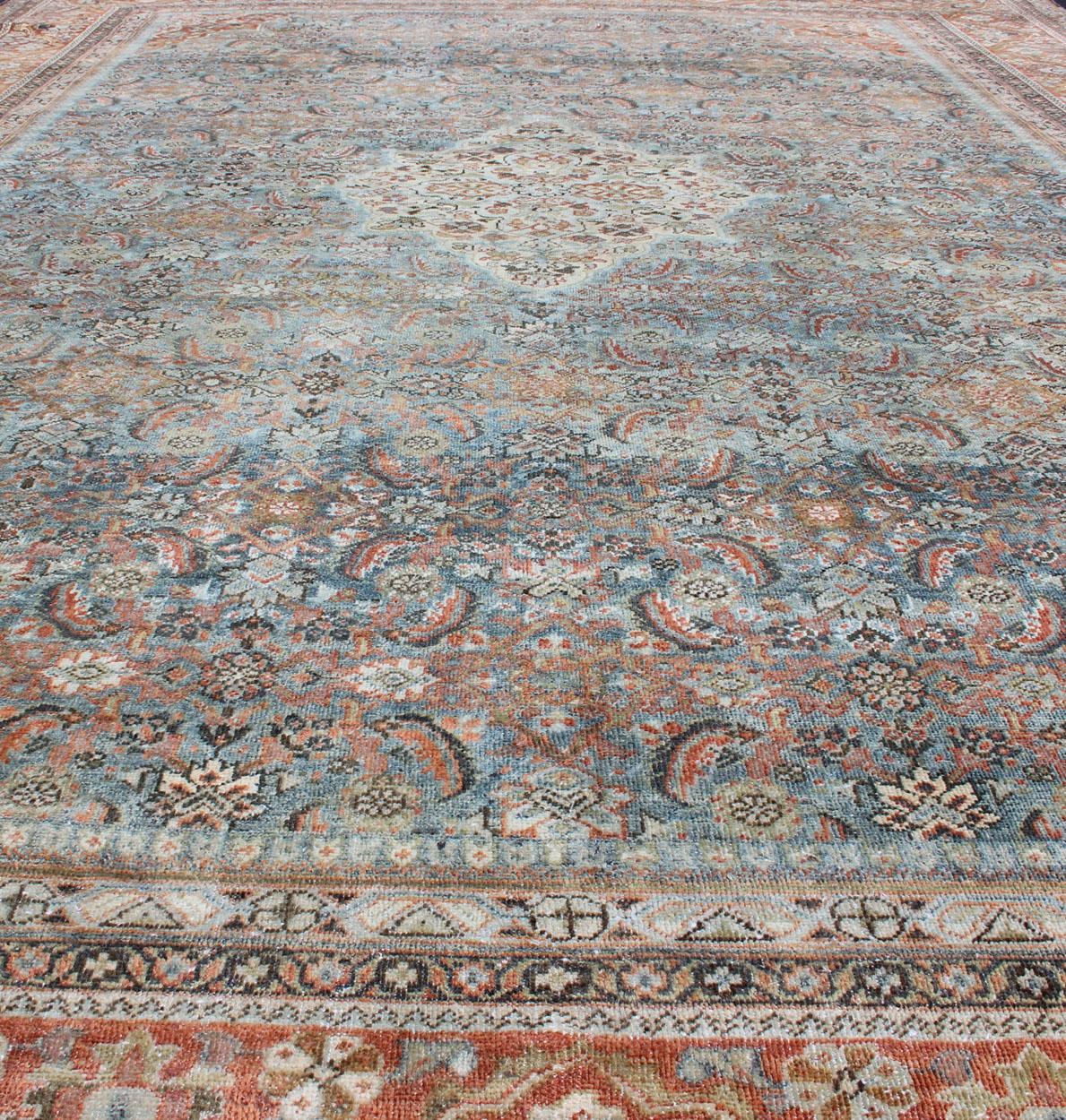 Distressed Antique Persian Sultanabad Rug in Steel Blue Background, Green, Red For Sale 1