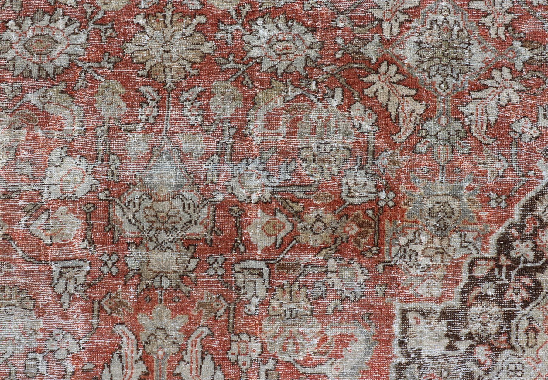 Distressed Antique Persian Sultanabad Rug in Wool with Floral Design In Fair Condition For Sale In Atlanta, GA