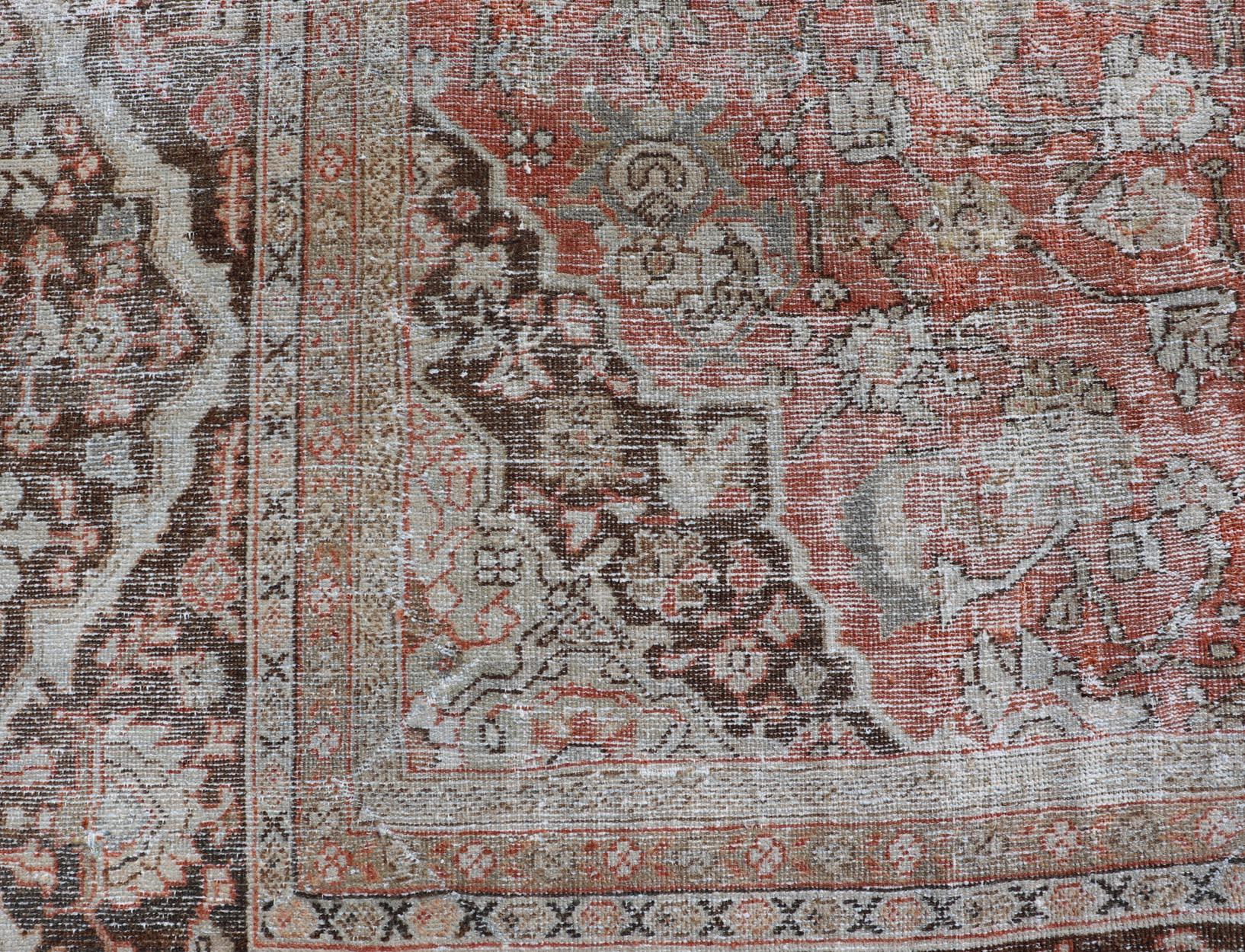 20th Century Distressed Antique Persian Sultanabad Rug in Wool with Floral Design For Sale